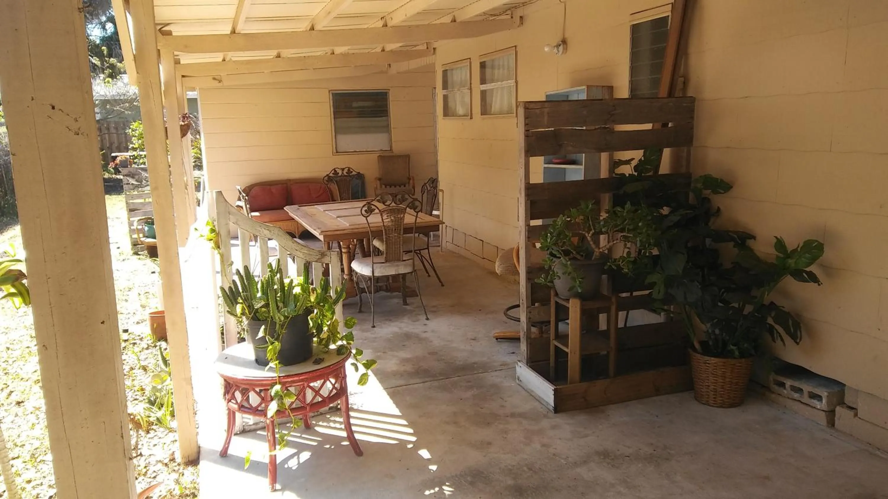 Seating area in 1 Beige Cozy Bungalow or 1 White Cozy Efficiency Cottage in Titusville