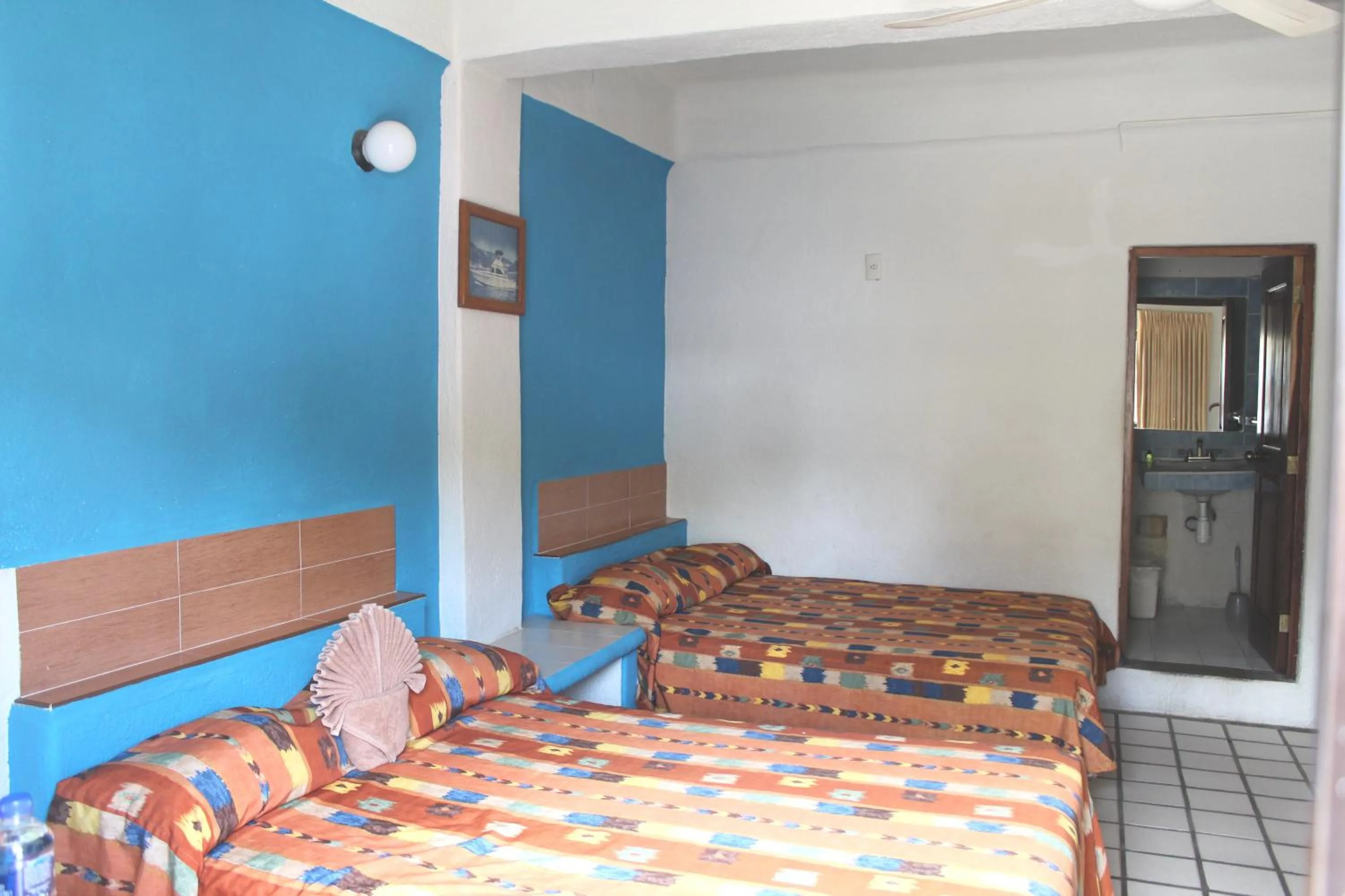 Photo of the whole room, Bed in Hotel Arrecife Huatulco Plus