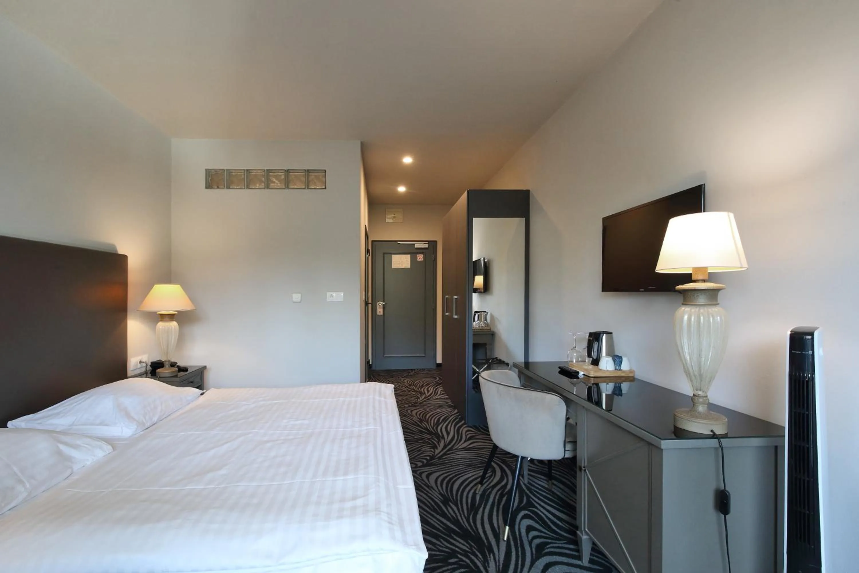 Bed in Carlsbad INN hotel & apartments