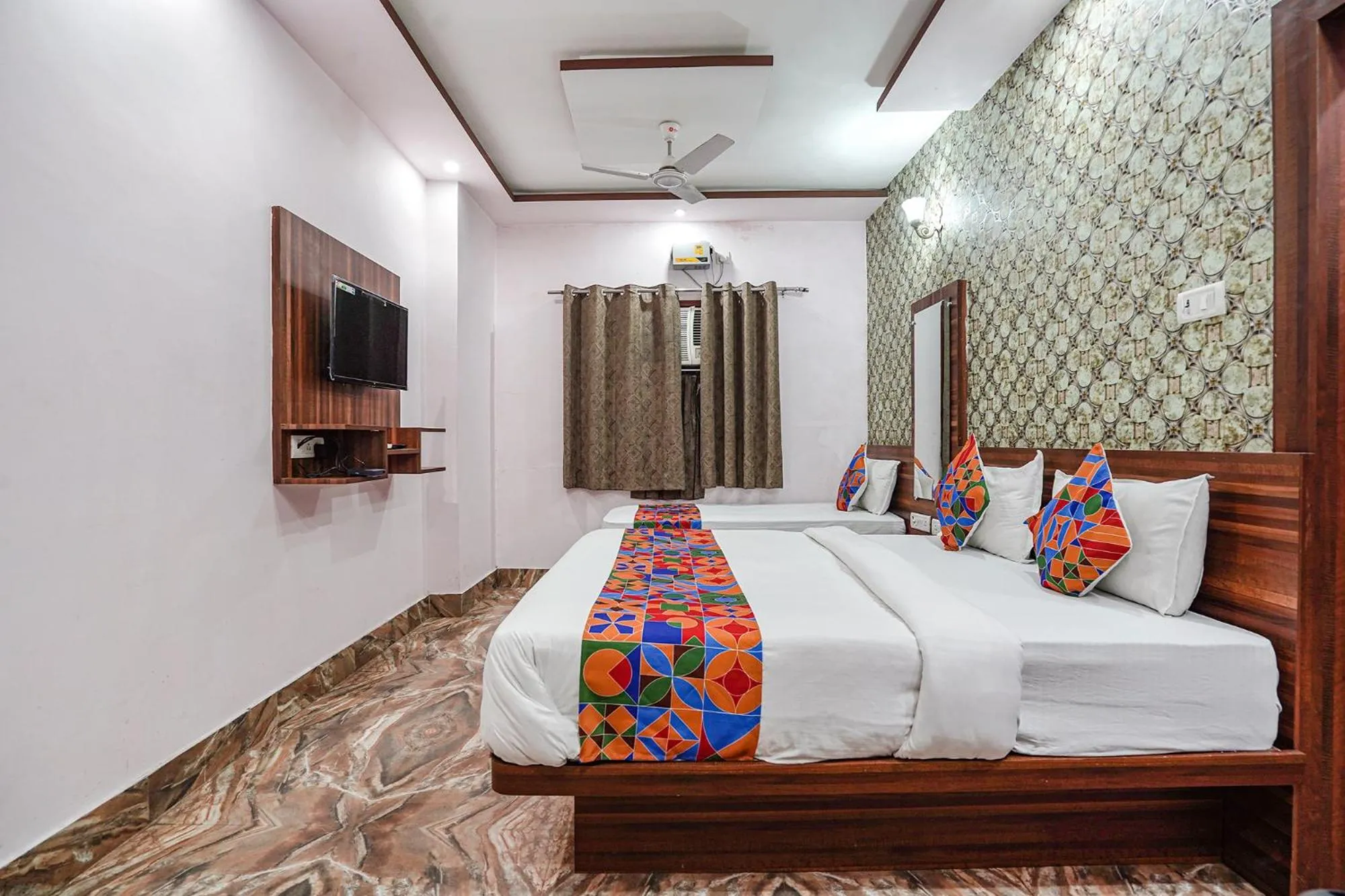 Bed in FabHotel Deepak Palace