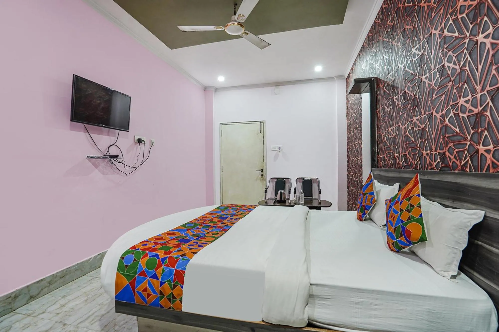 Bed in FabHotel Deepak Palace