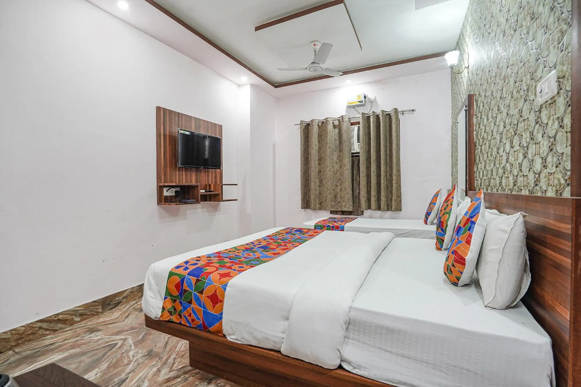 Bed in FabHotel Deepak Palace