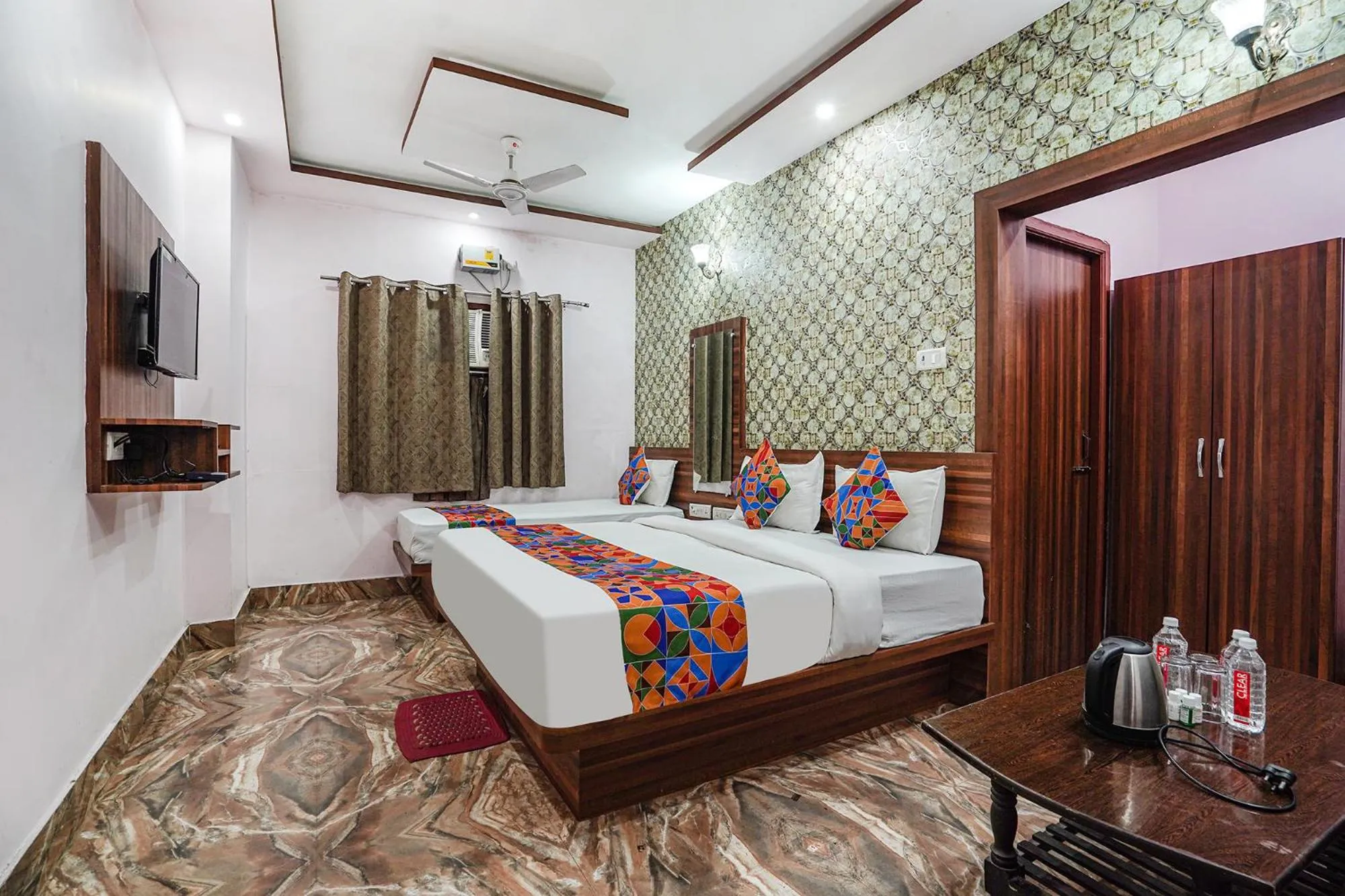 Bed in FabHotel Deepak Palace