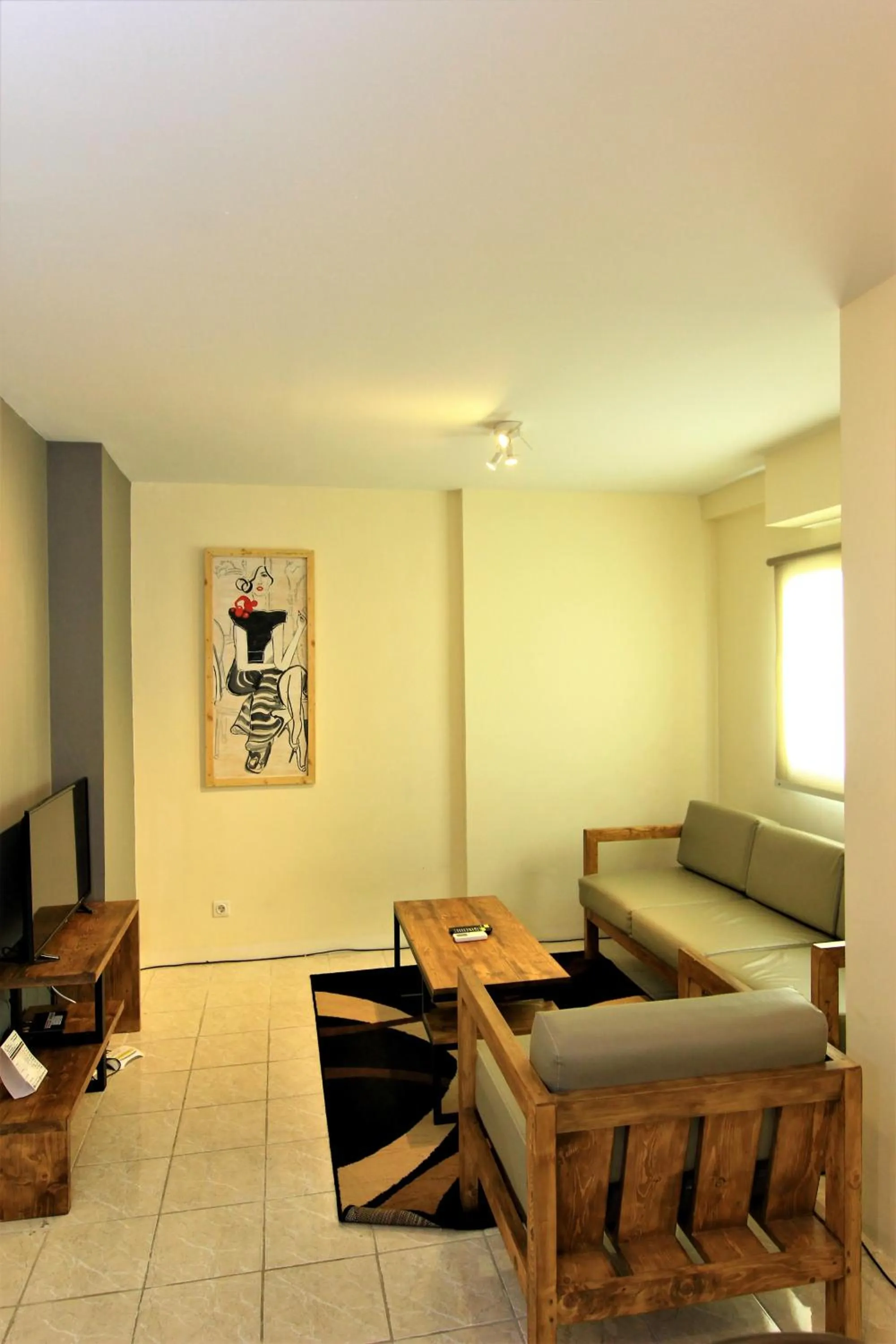 Living room in Queen Victoria Apartment Batam