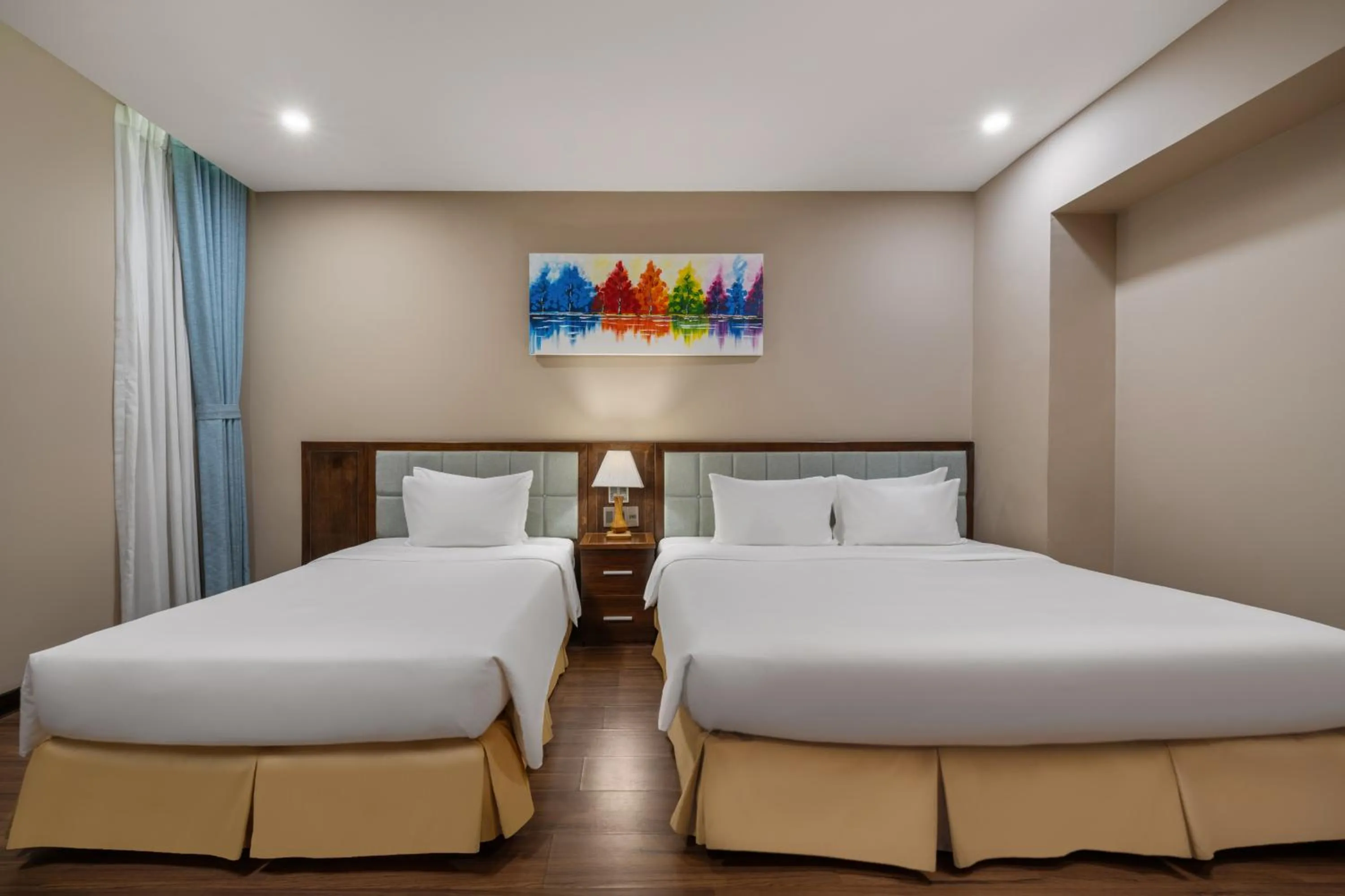 Bed in Yarra Ocean Suites Danang