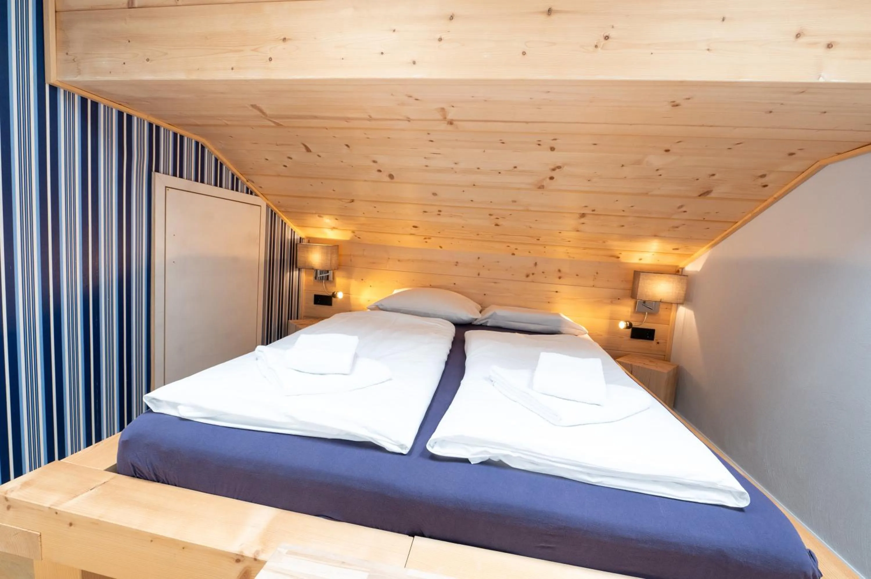 Bedroom, Bed in ALPENLIEBE - Sauna & Whirlpool - APARTments