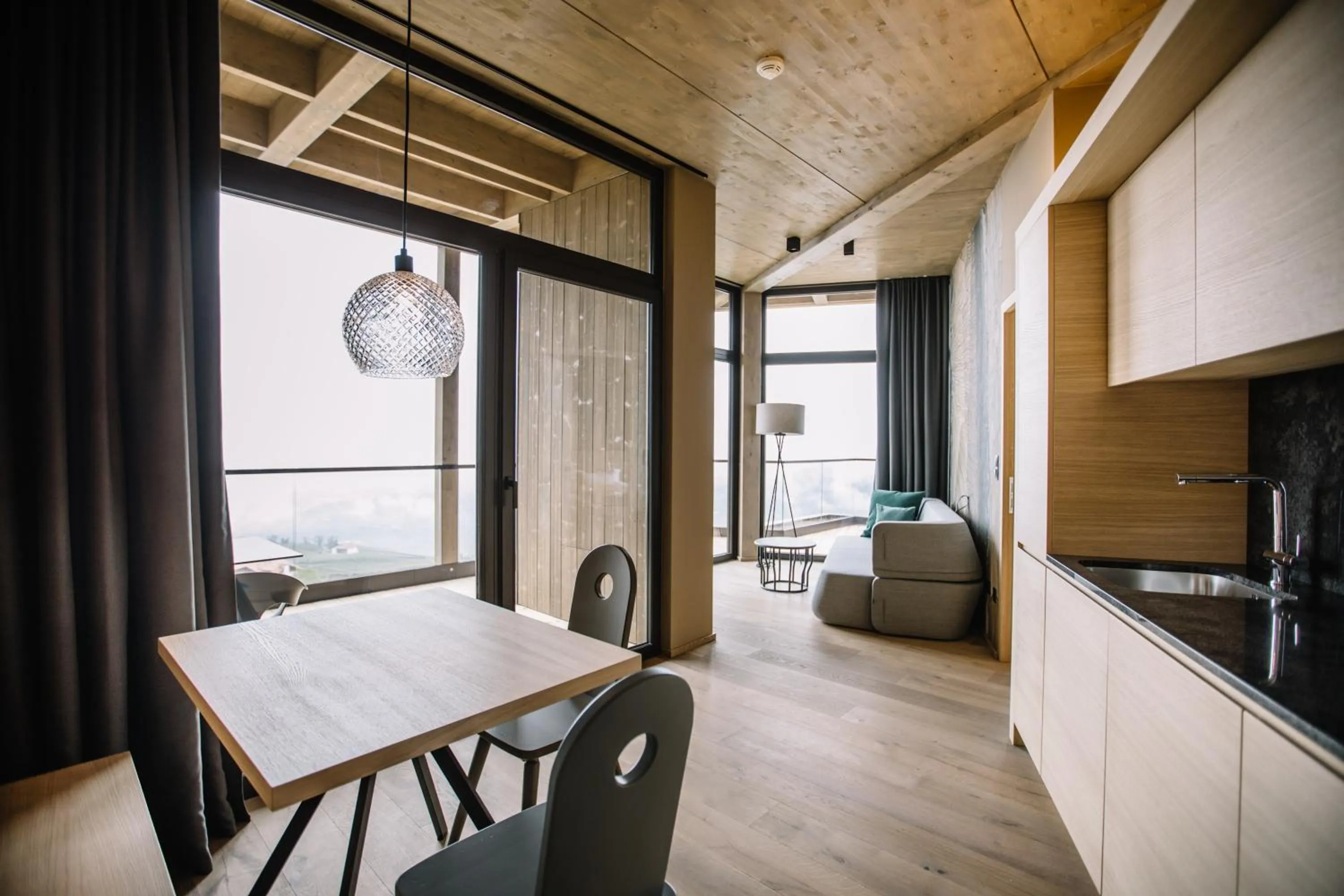 Living room, Bed in Panoramic Suites Winzerhöhe