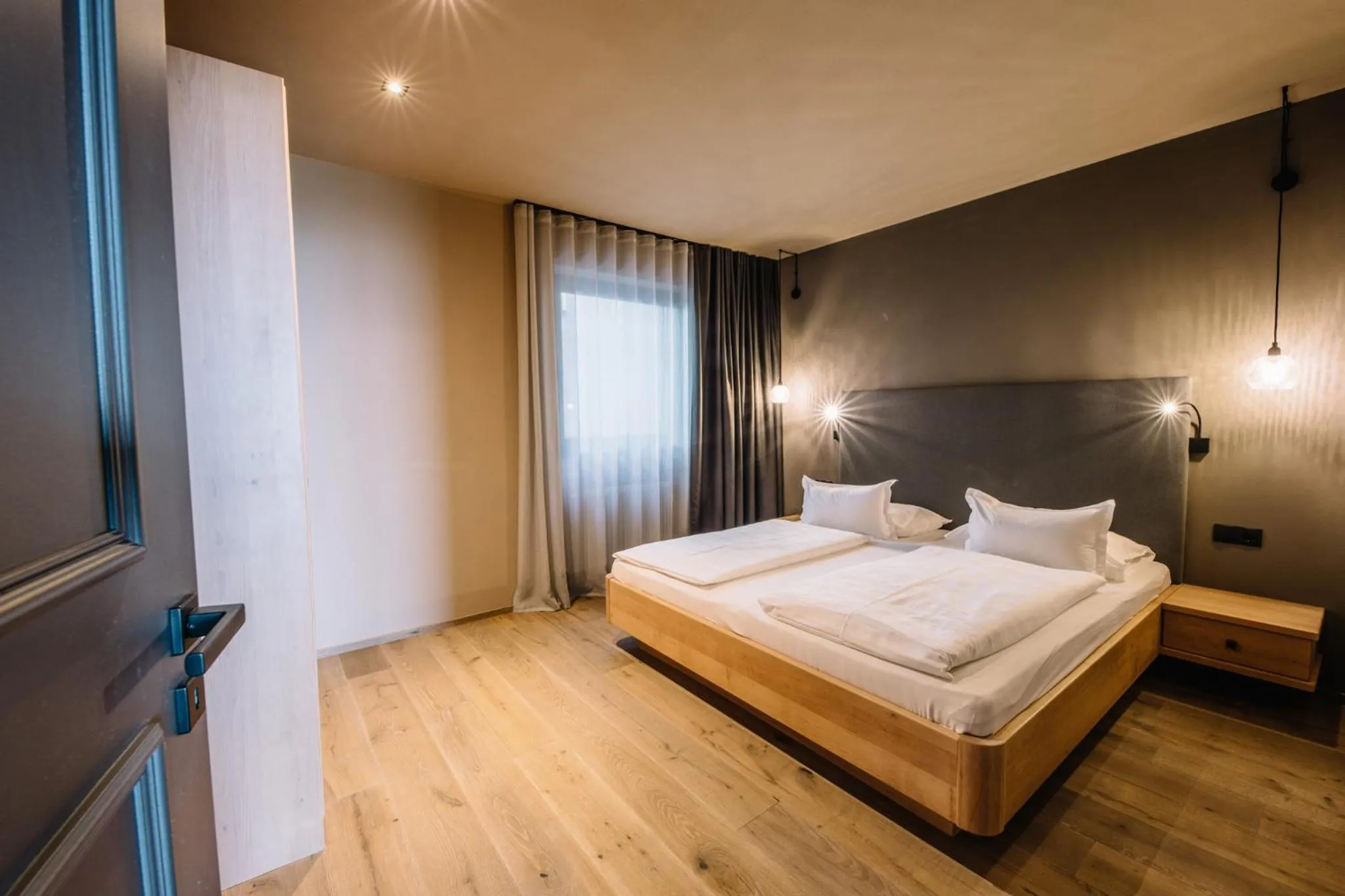 Bed in Panoramic Suites Winzerhöhe