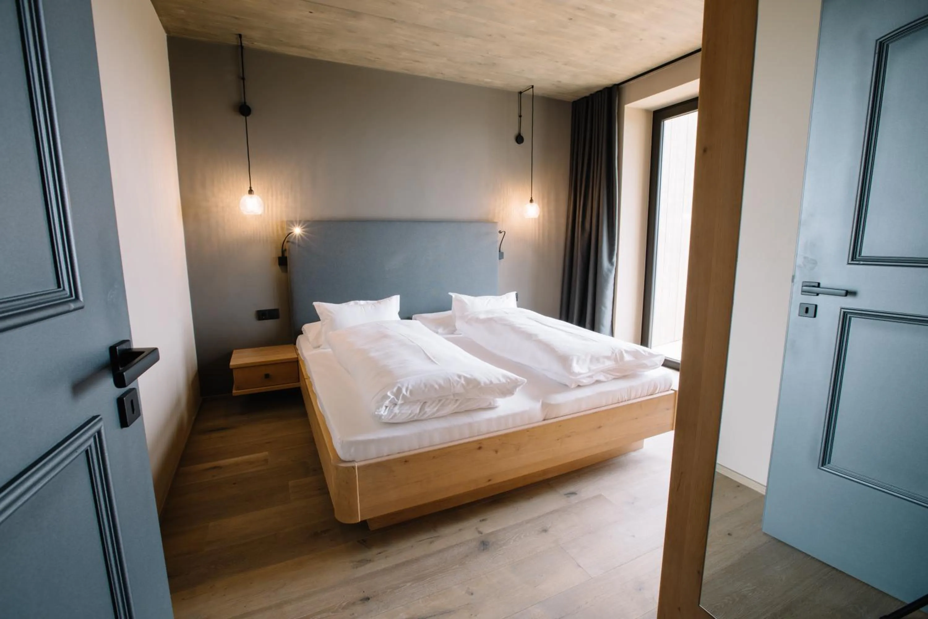 Bed in Panoramic Suites Winzerhöhe