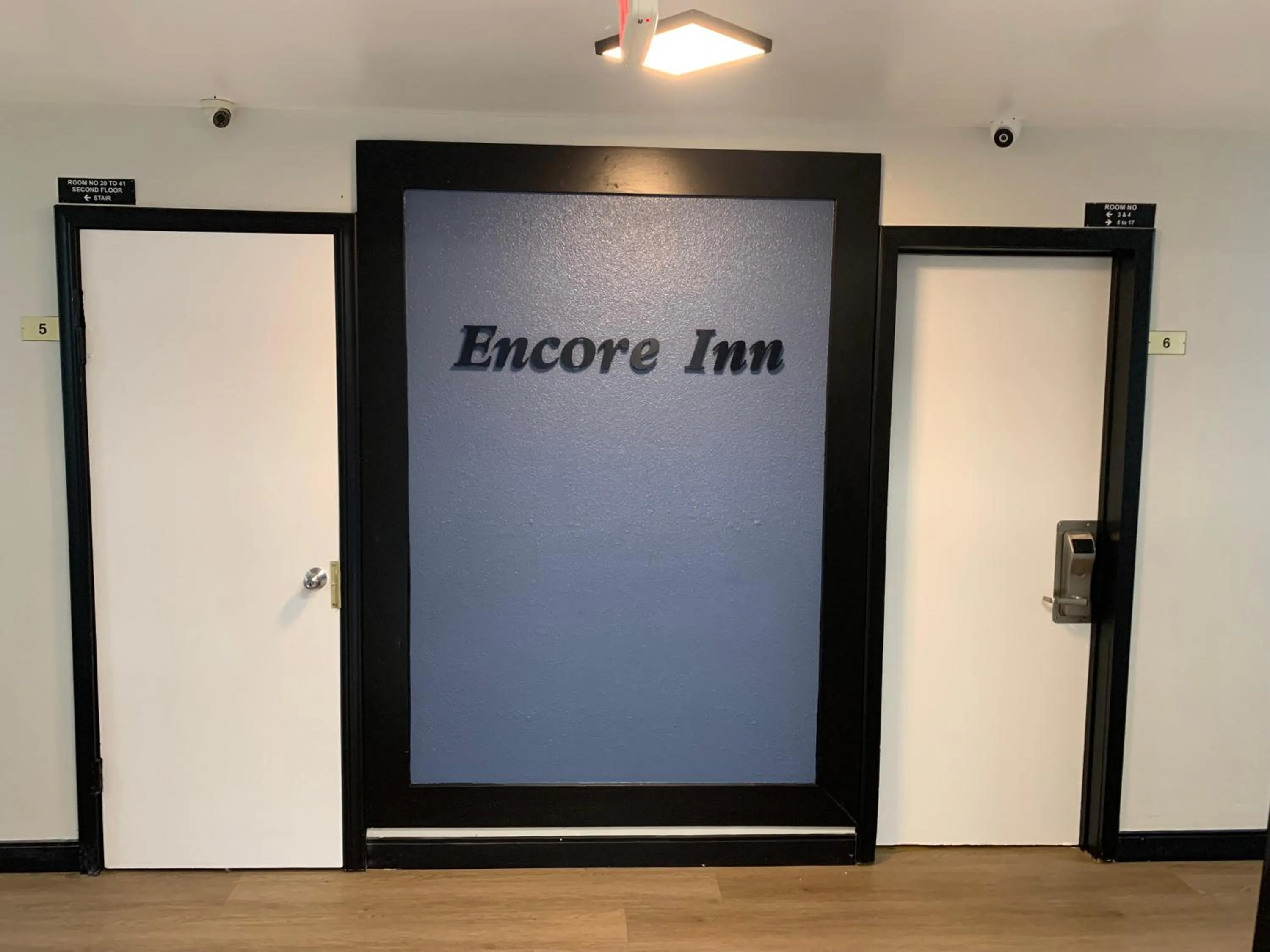 Property logo or sign in Encore Inn Inglewood