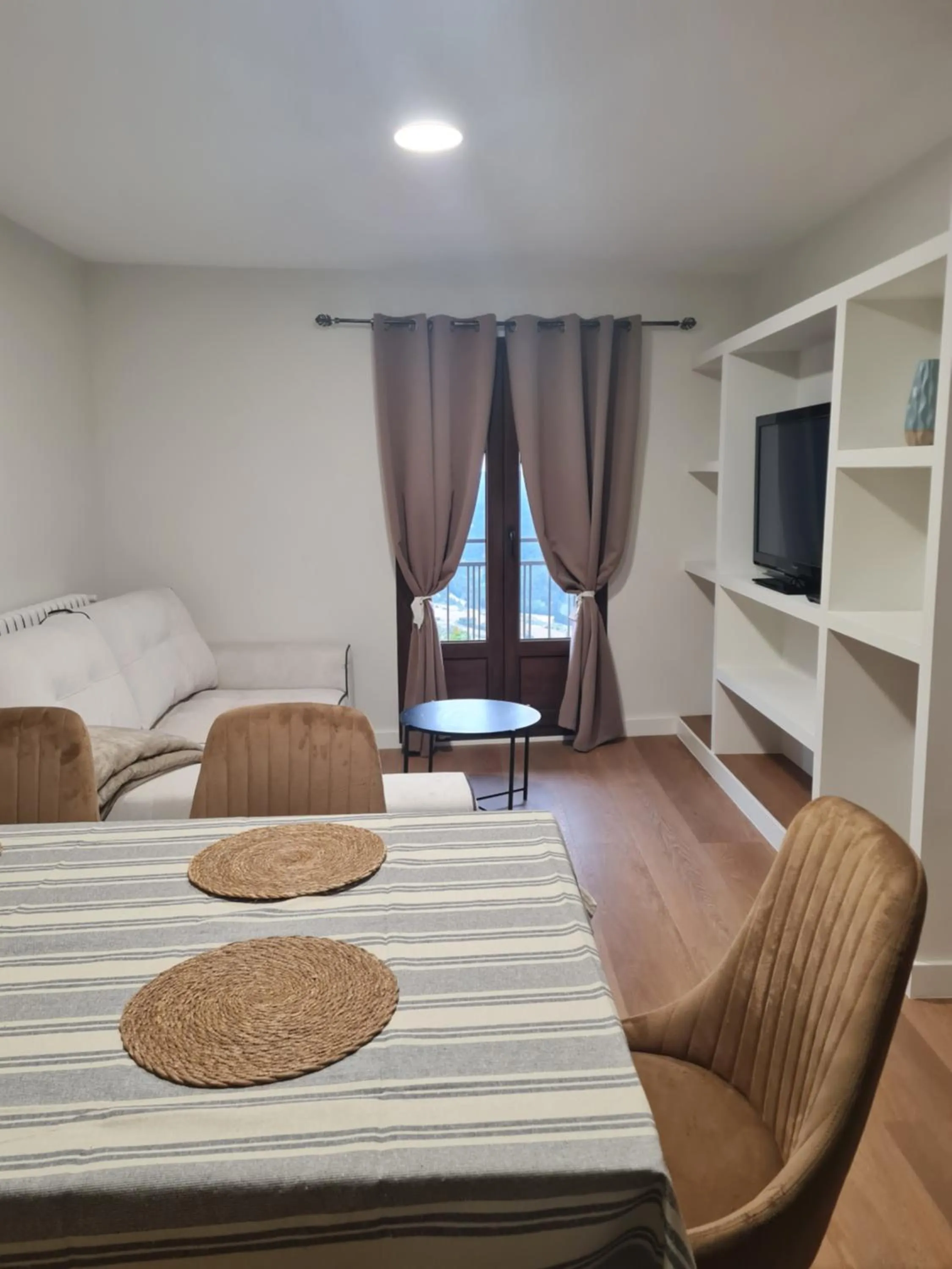 Communal lounge/ TV room, Bed in Apartamentos Mirador de Gúdar