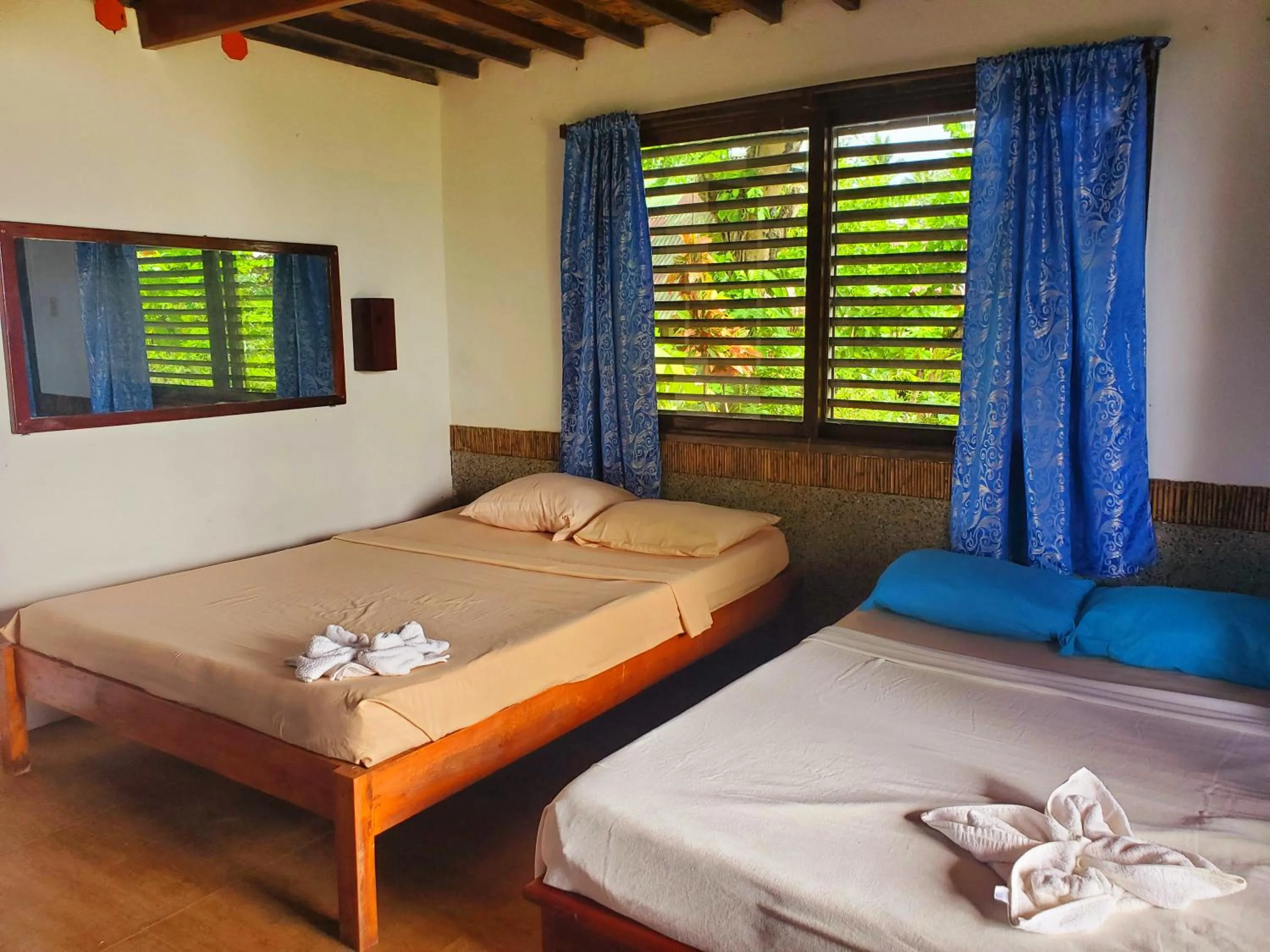 Bed in Patrick's on the Beach Resort