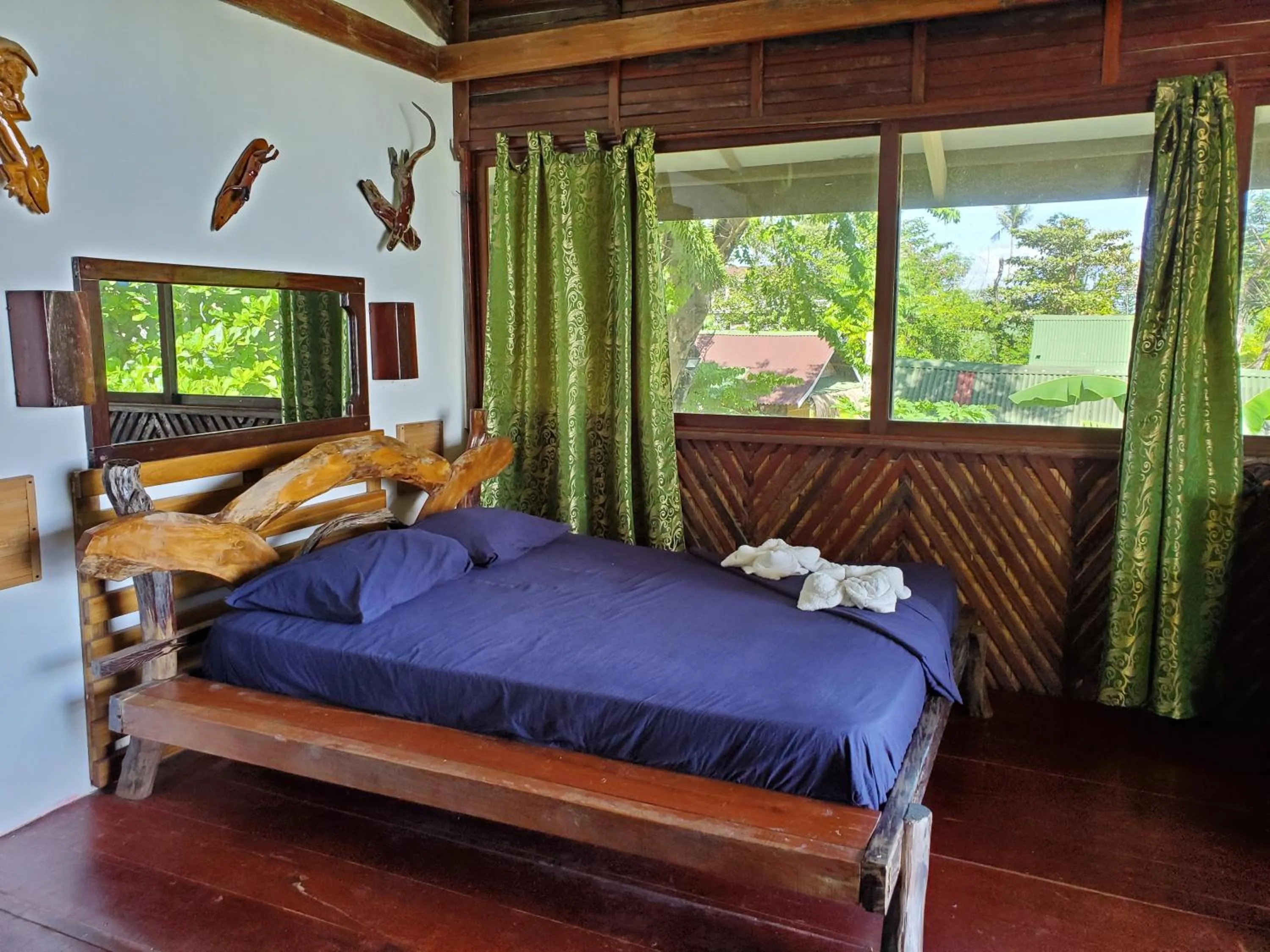 Bed in Patrick's on the Beach Resort