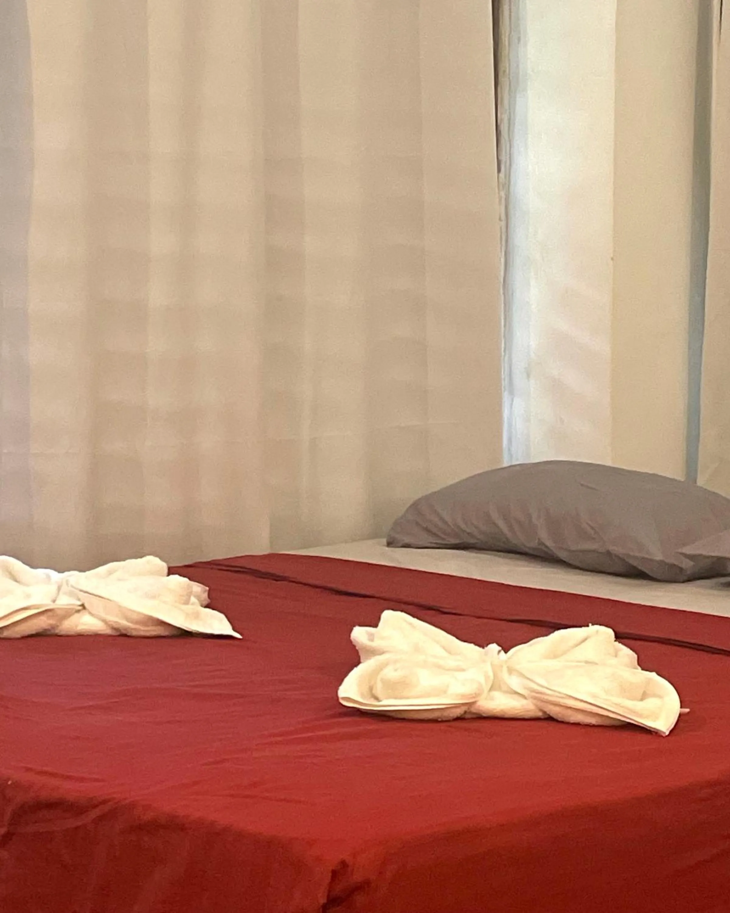 Bed in Patrick's on the Beach Resort