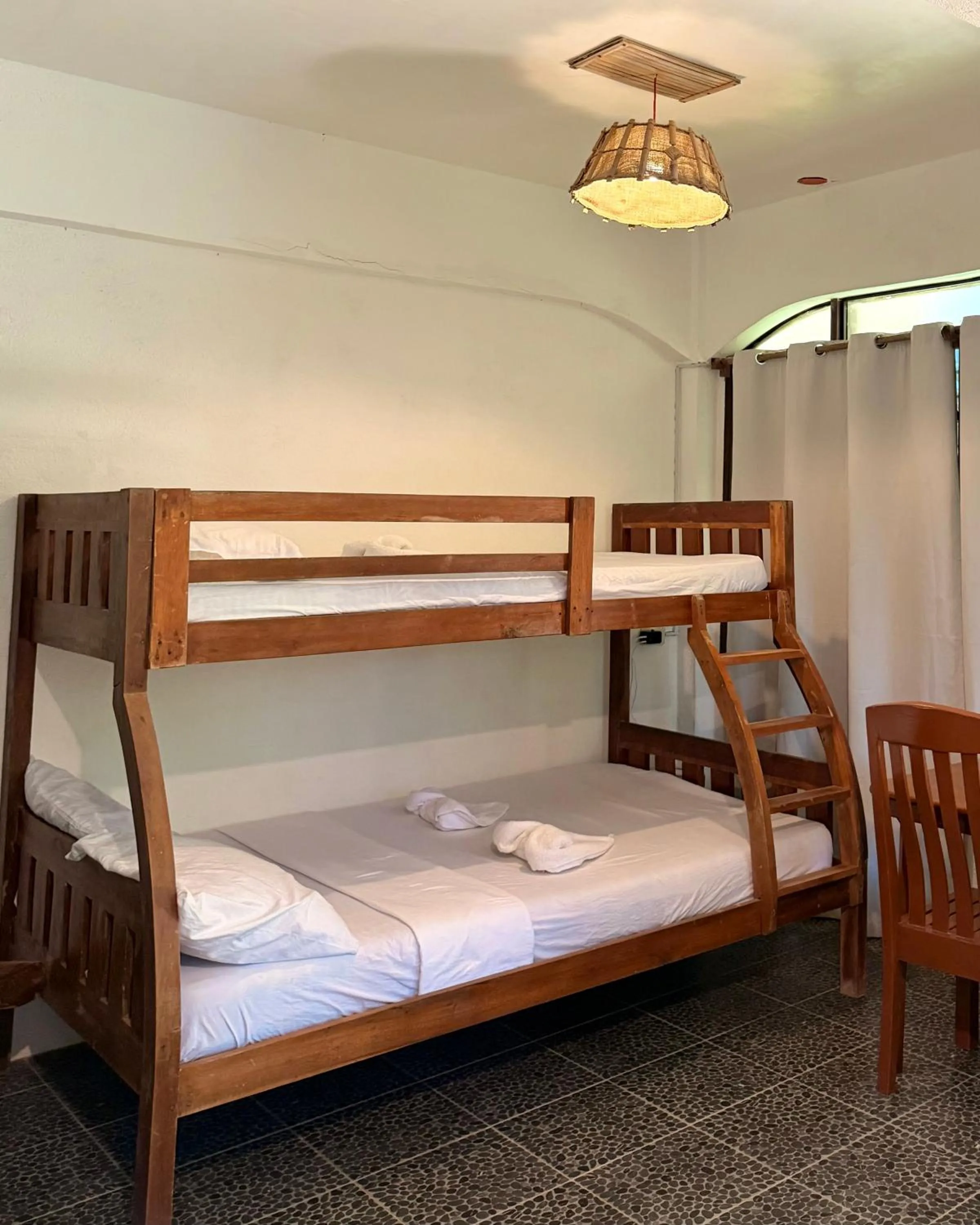 Bed in Patrick's on the Beach Resort