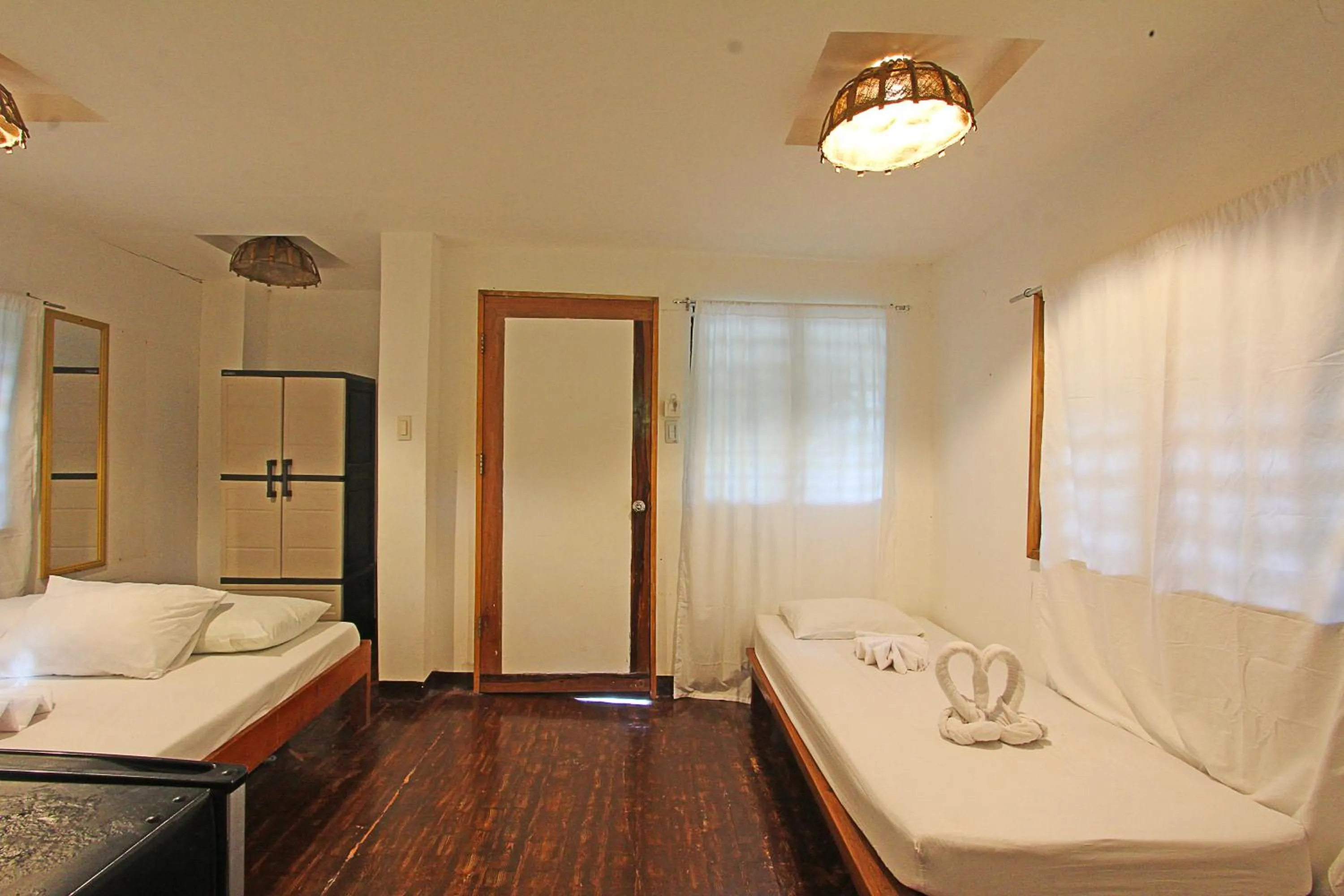 Bed in Patrick's on the Beach Resort