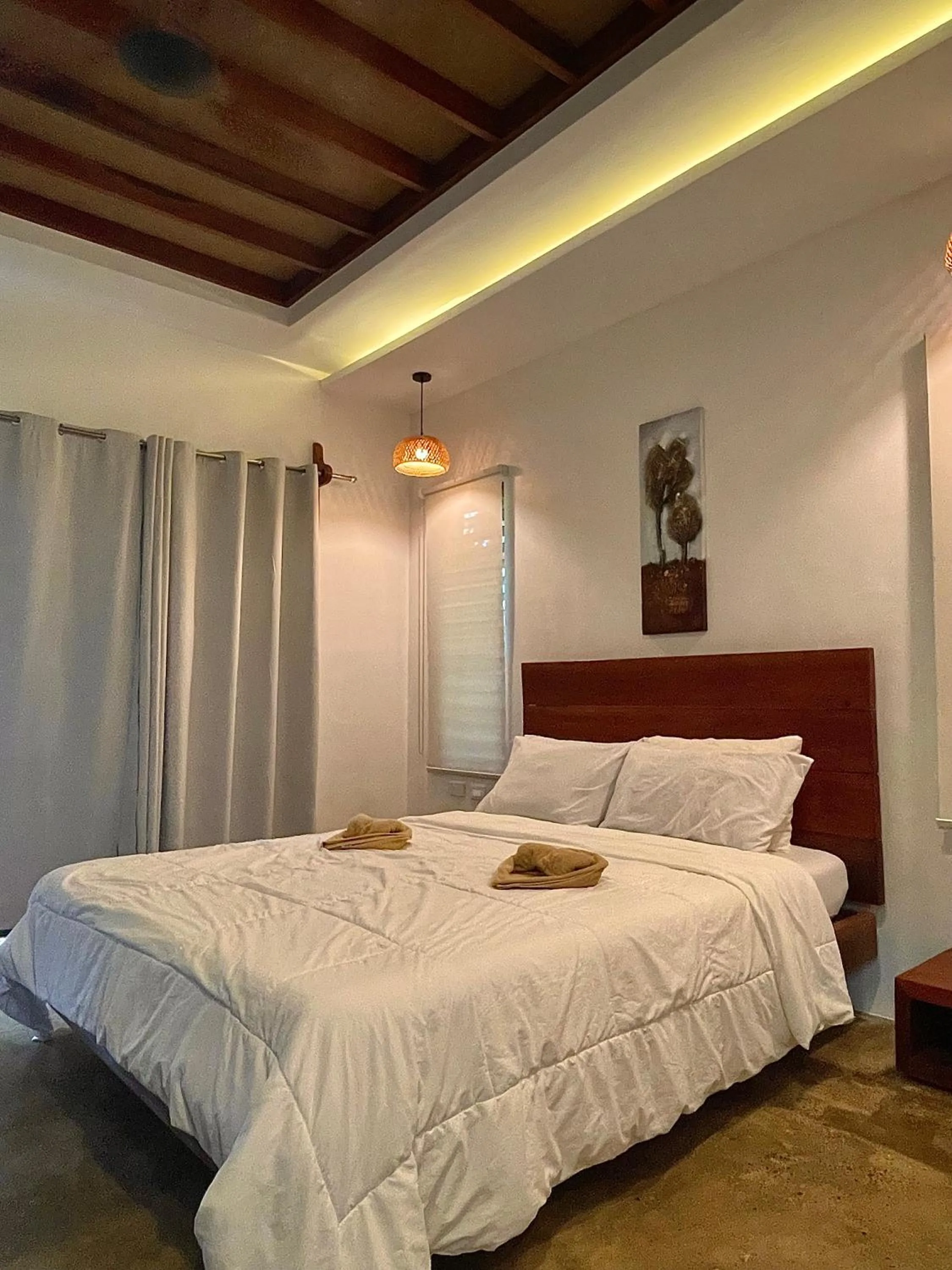 Bed in Patrick's on the Beach Resort