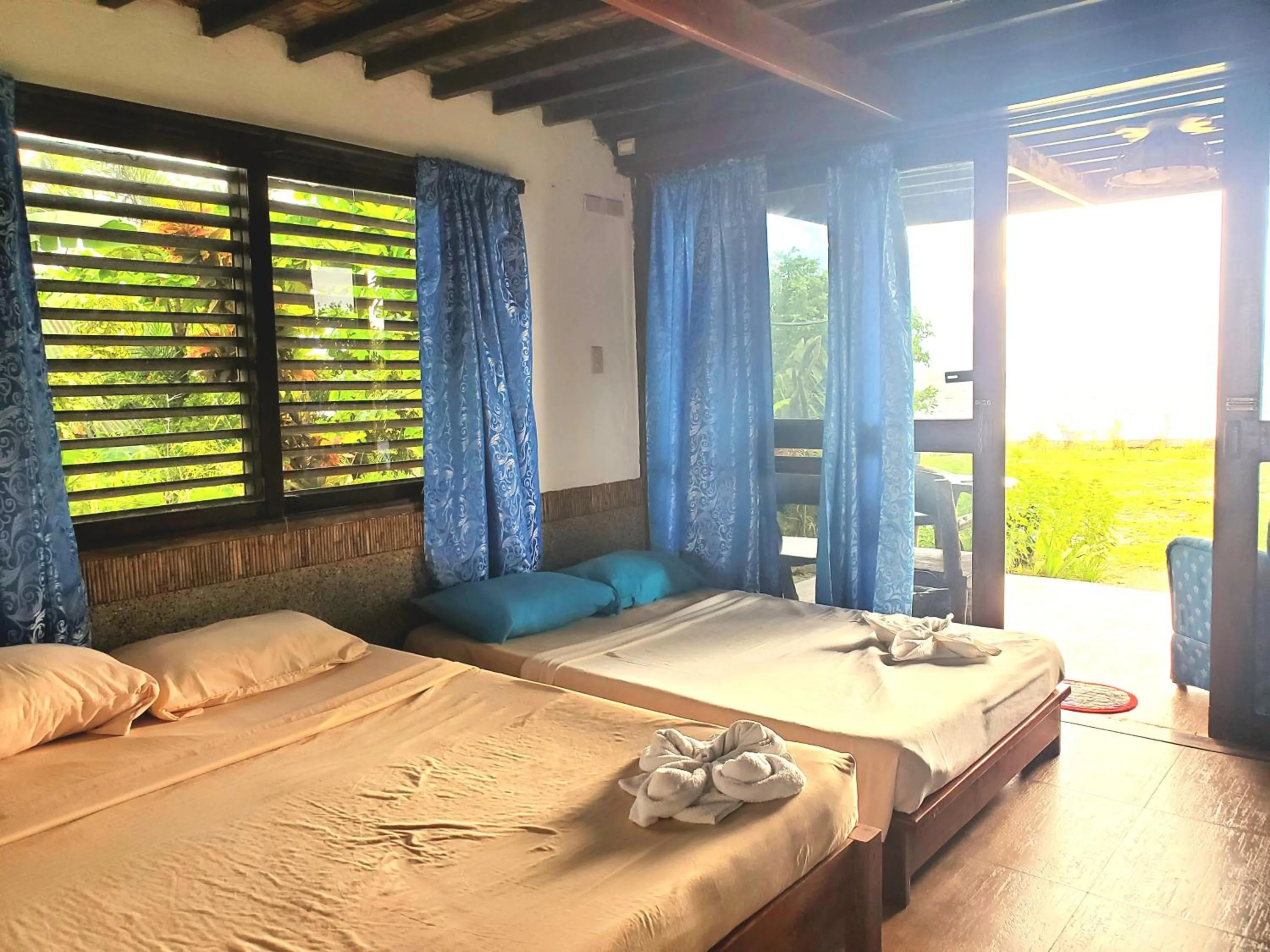 Photo of the whole room, Bed in Patrick's on the Beach Resort