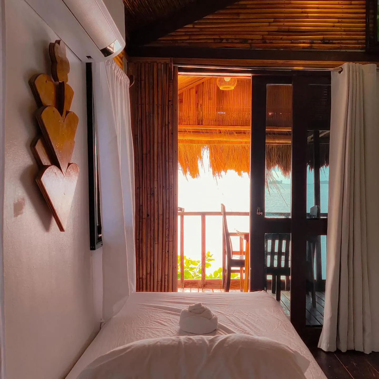 Bed in Patrick's on the Beach Resort