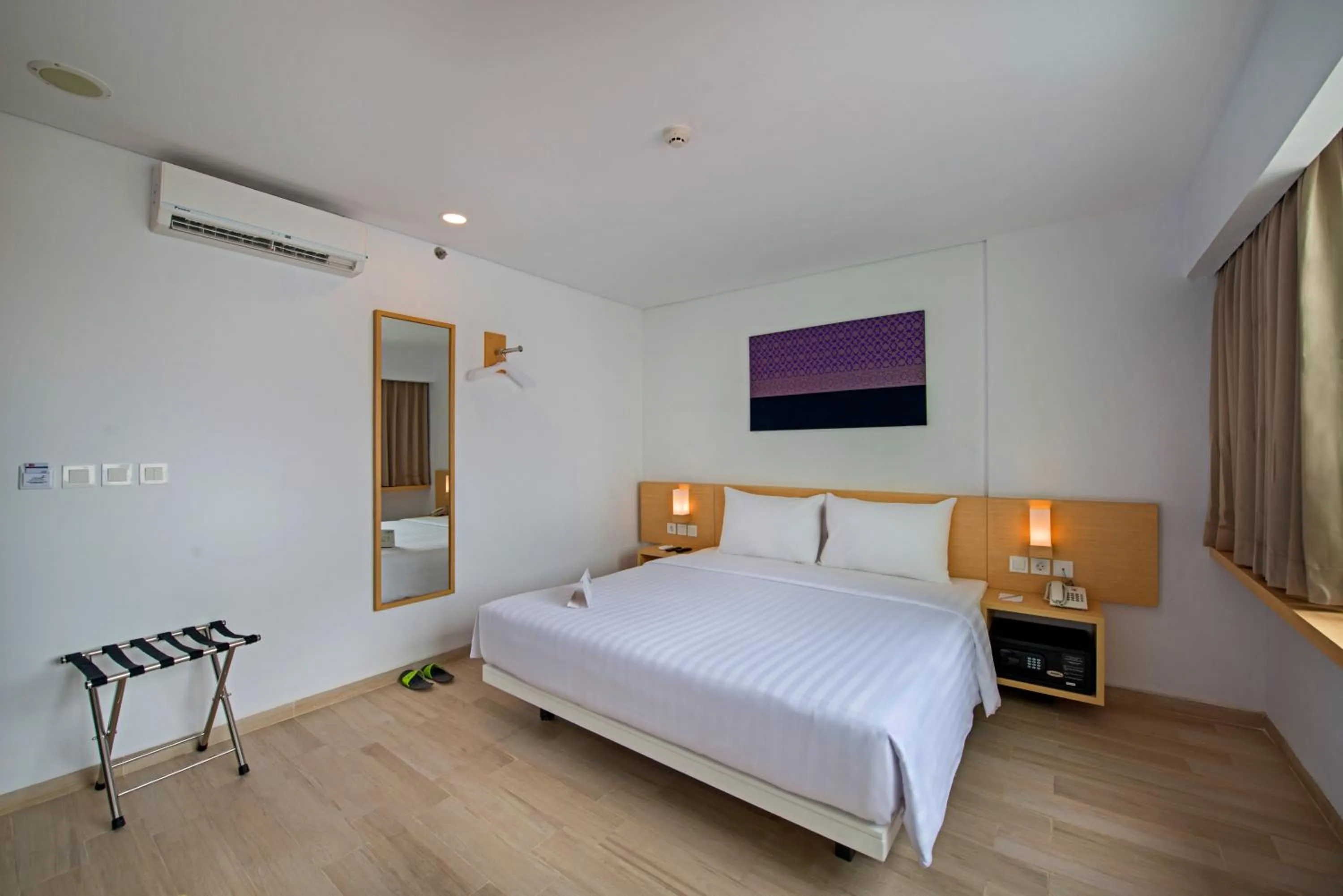 Photo of the whole room, Bed in Whiz Prime Hotel Sudirman Pekanbaru