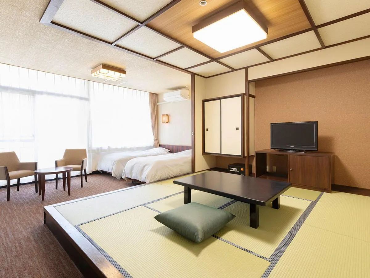 Bed in Ooedo Onsen Monogatari Premium Hotel New Shiobara