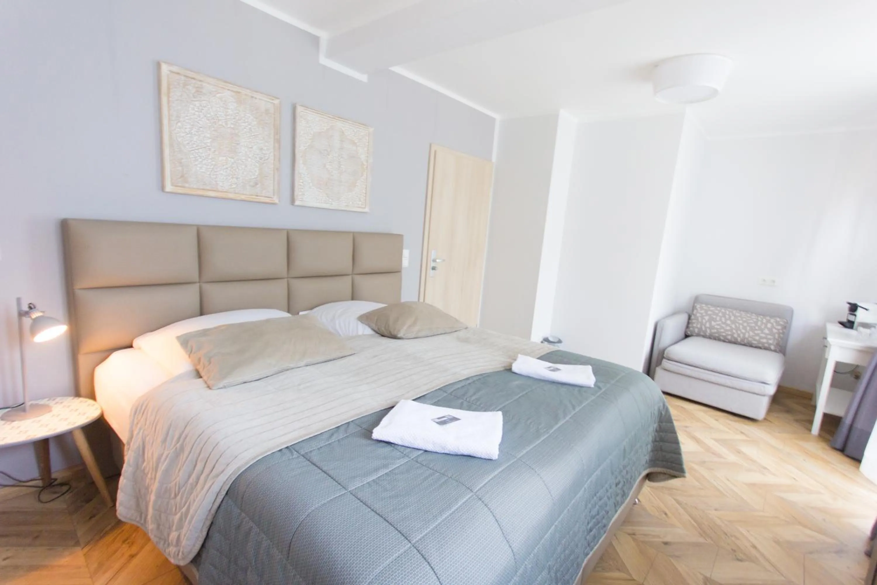 Photo of the whole room, Bed in TM Suites