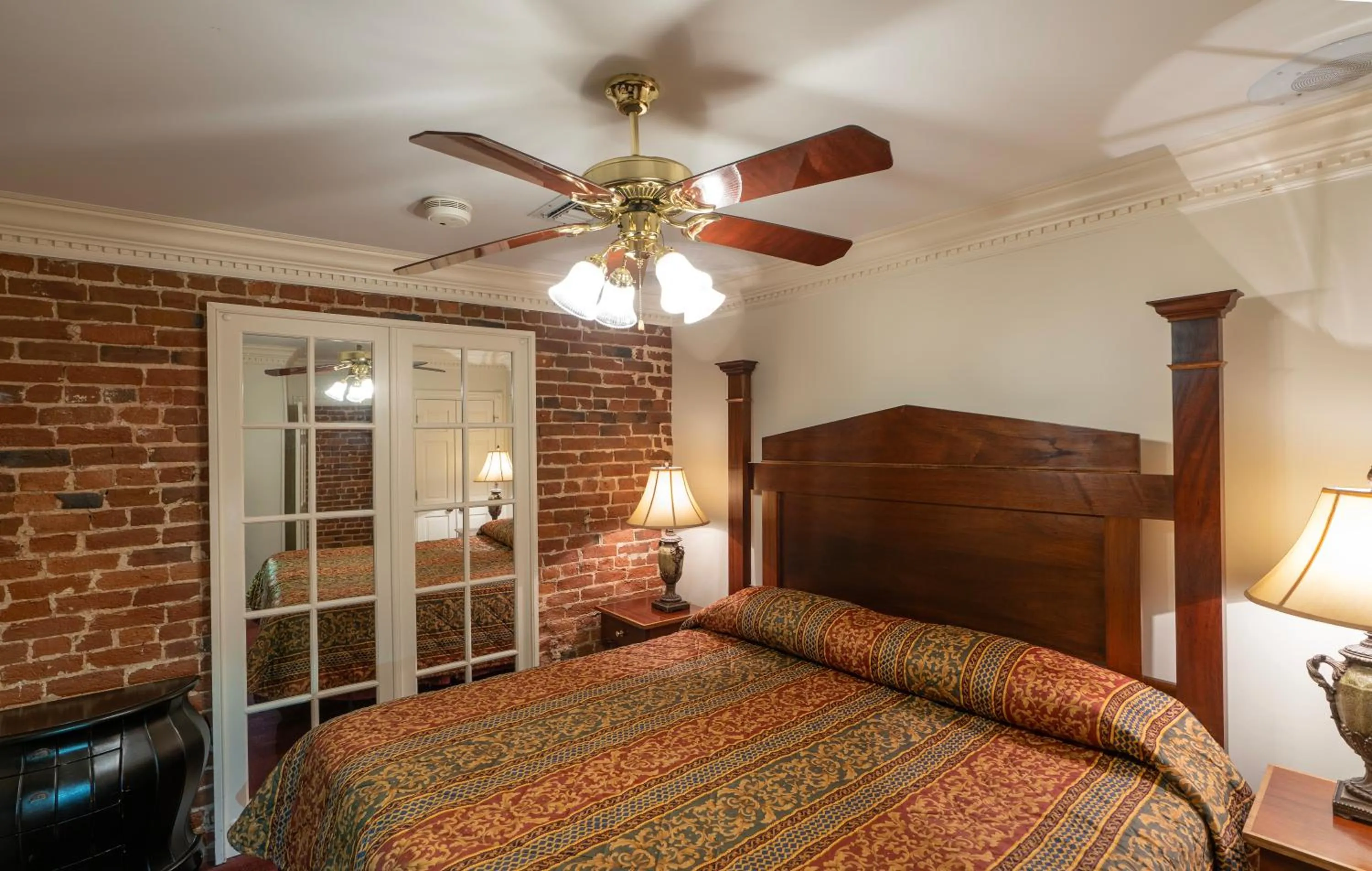 Bed in Quarter House Suites