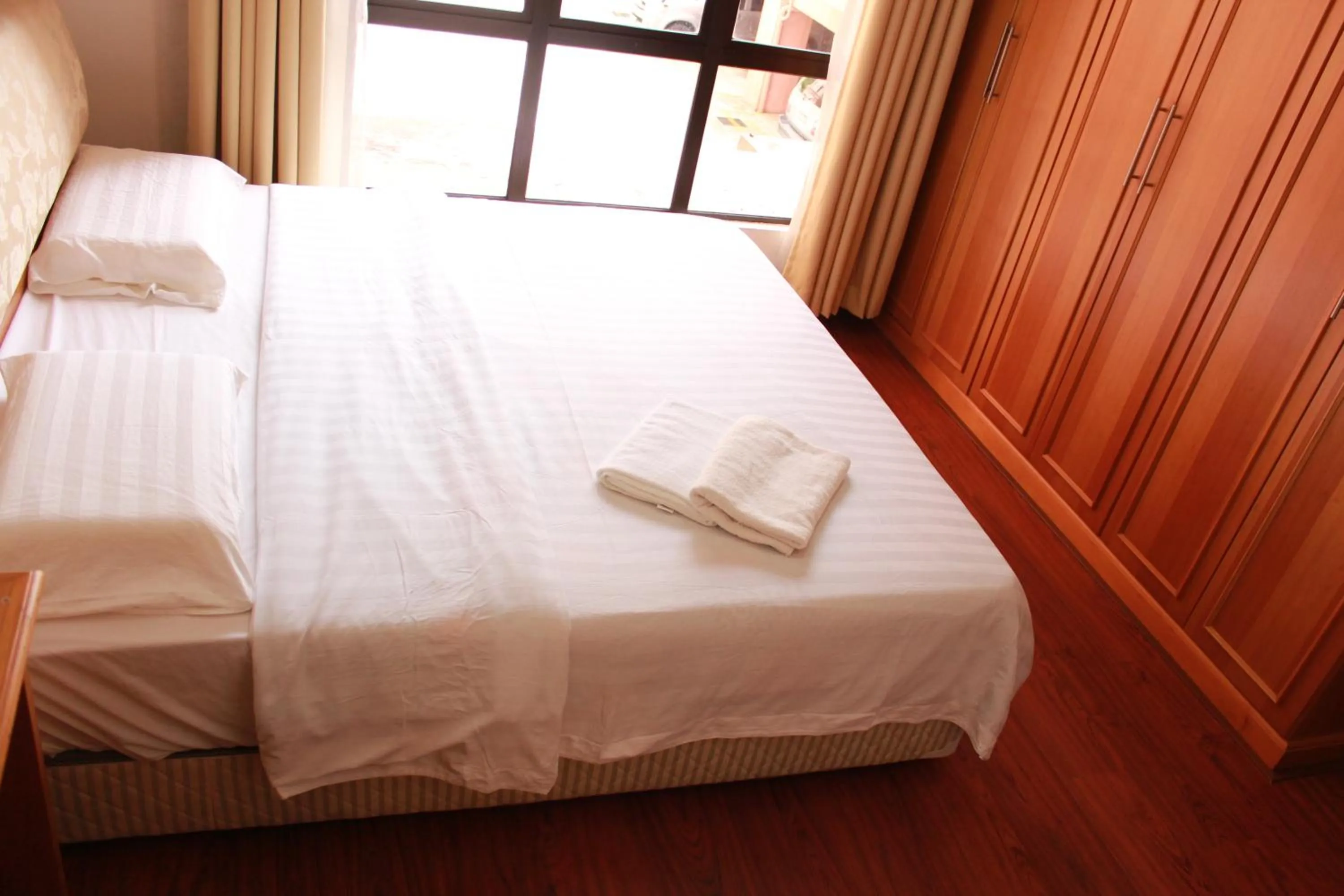 Bed in Homestay Marina Court Resort