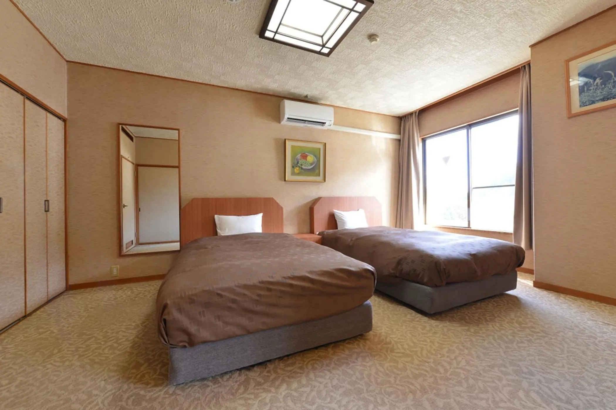 Bed in Ooedo Onsen Monogatari Shinshu Kakeyu