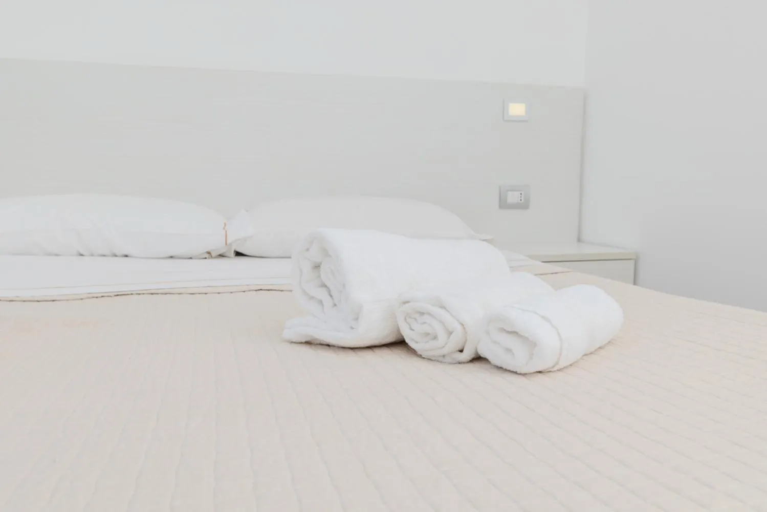 Bed in Antares Rooms and Suites