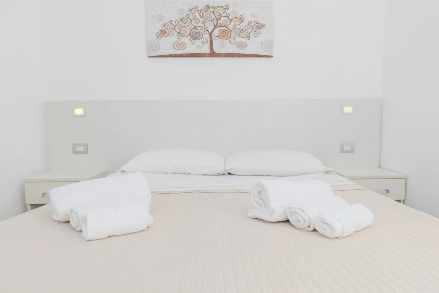 Bed in Antares Rooms and Suites