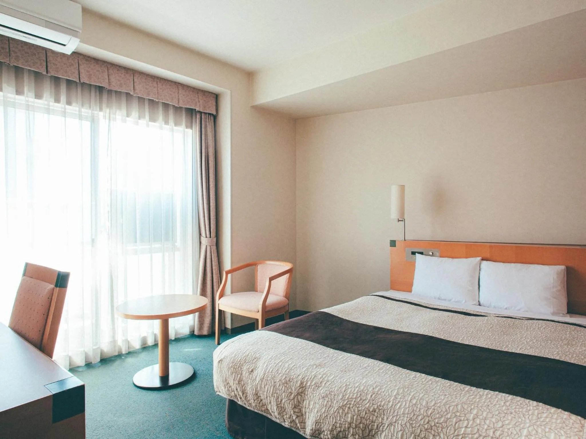 Bed in Kuretake Inn Okayama