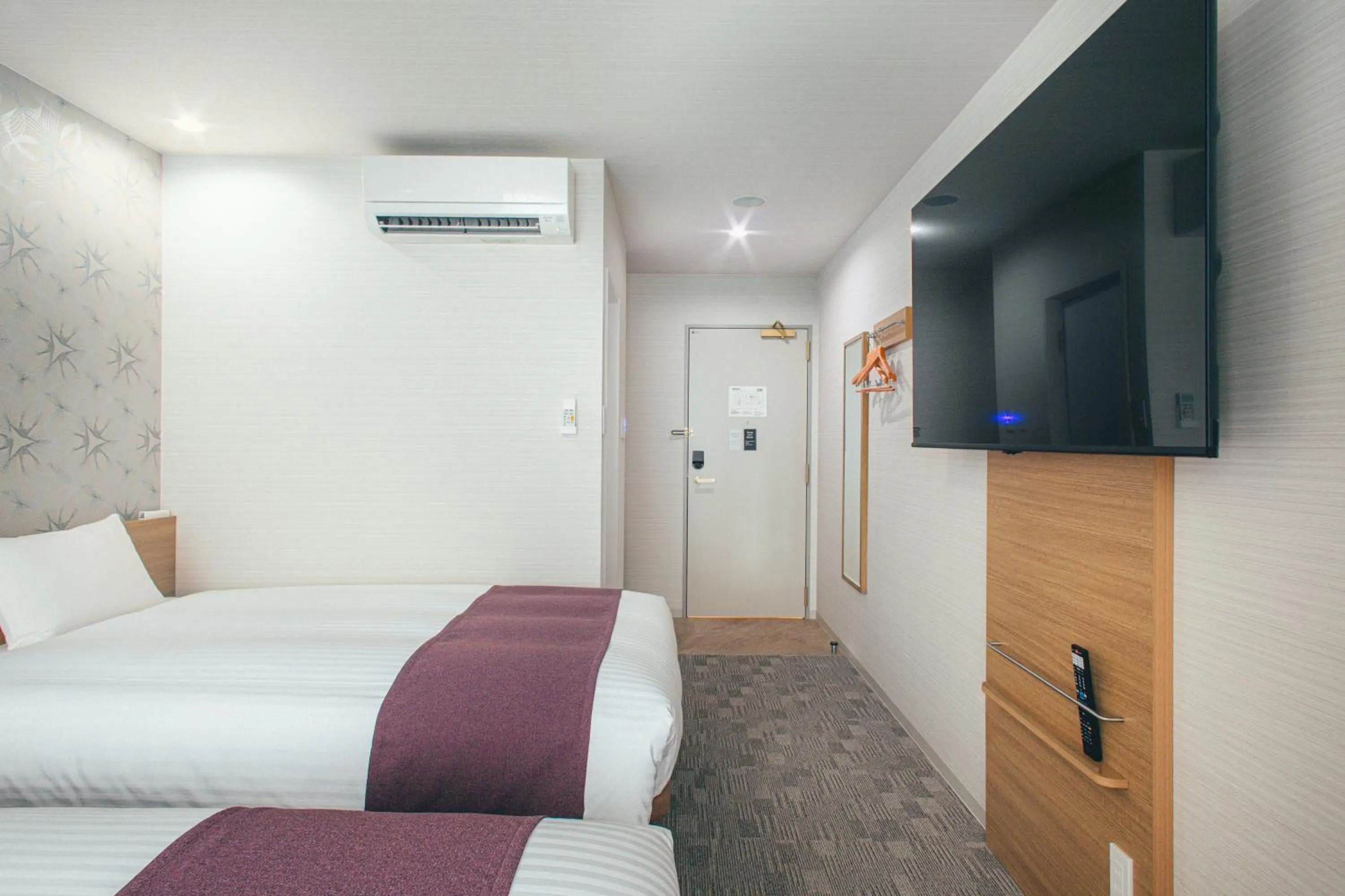 Bed in Kuretake Inn Okayama