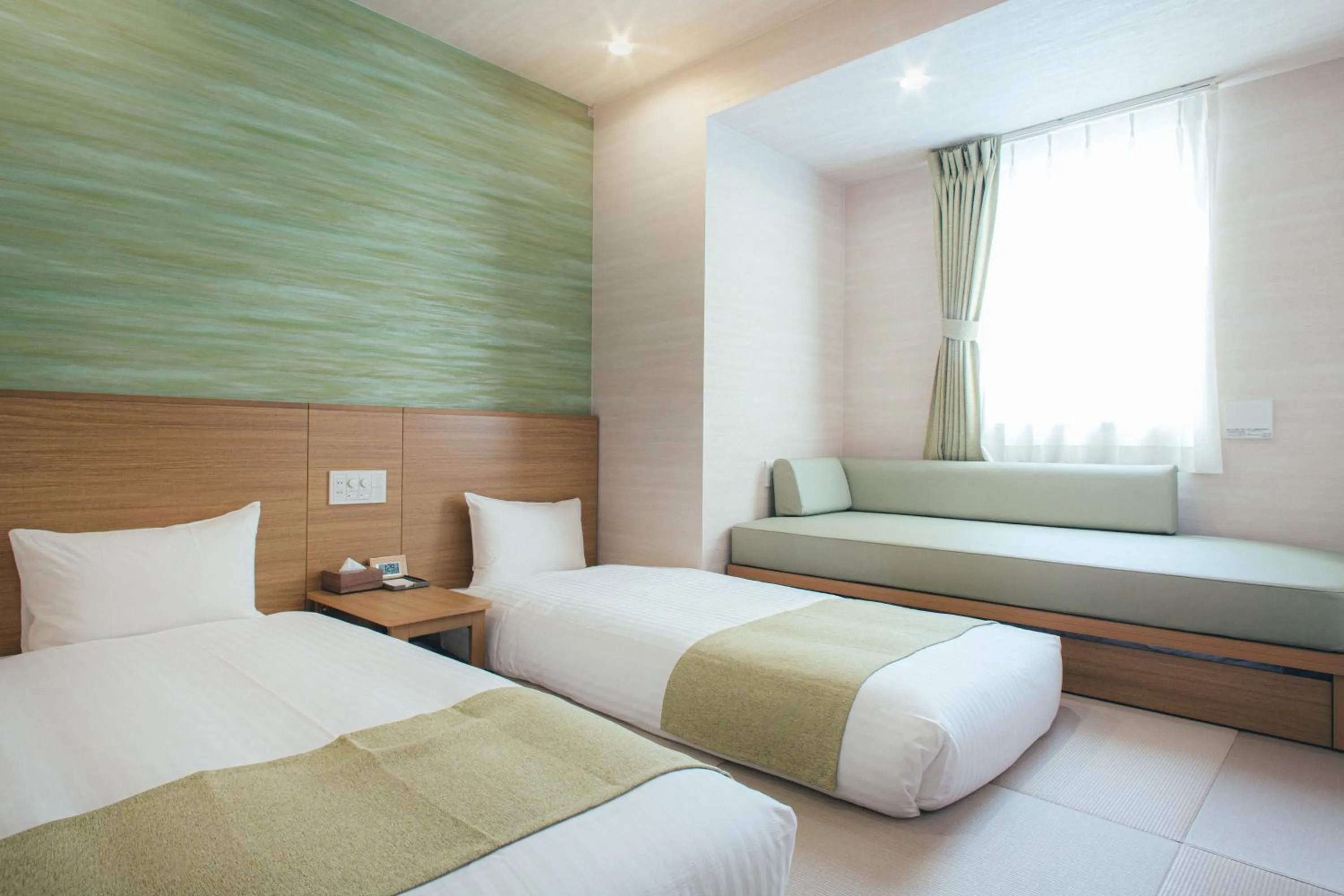 Bed in Kuretake Inn Okayama