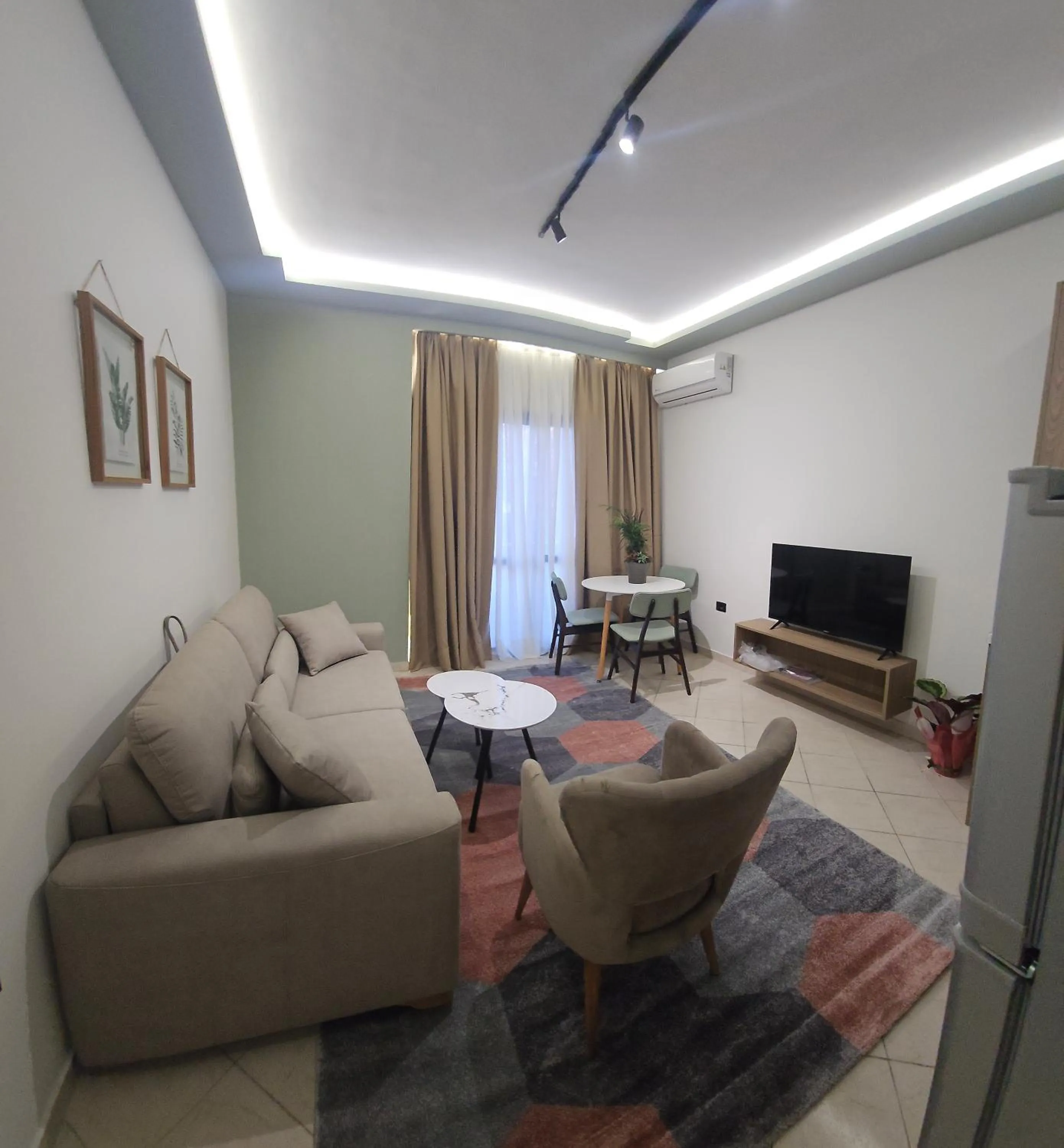 Communal lounge/ TV room in Oda Hotel Tirana