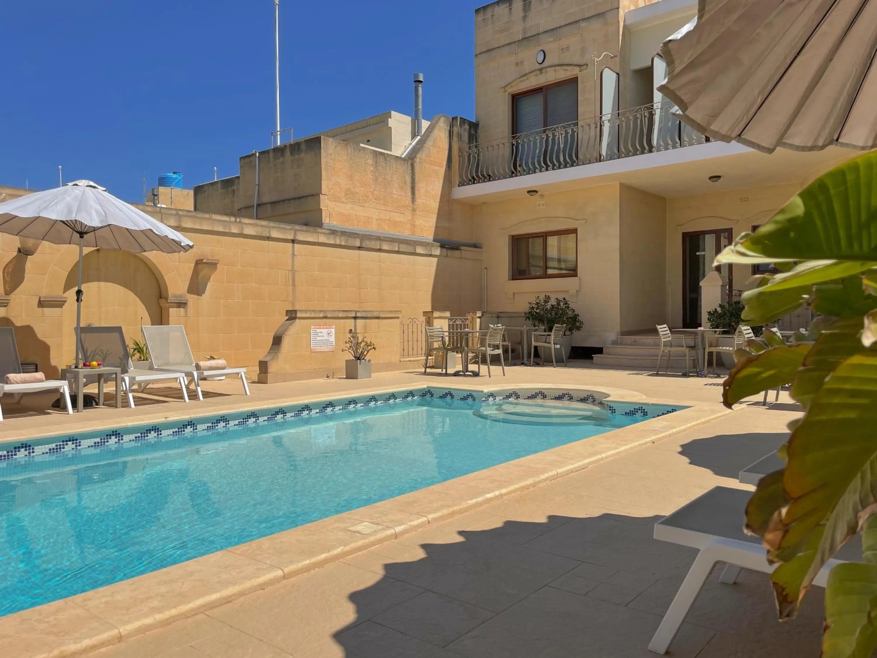 Swimming pool in IL-Gardjola Bed and Breakfast