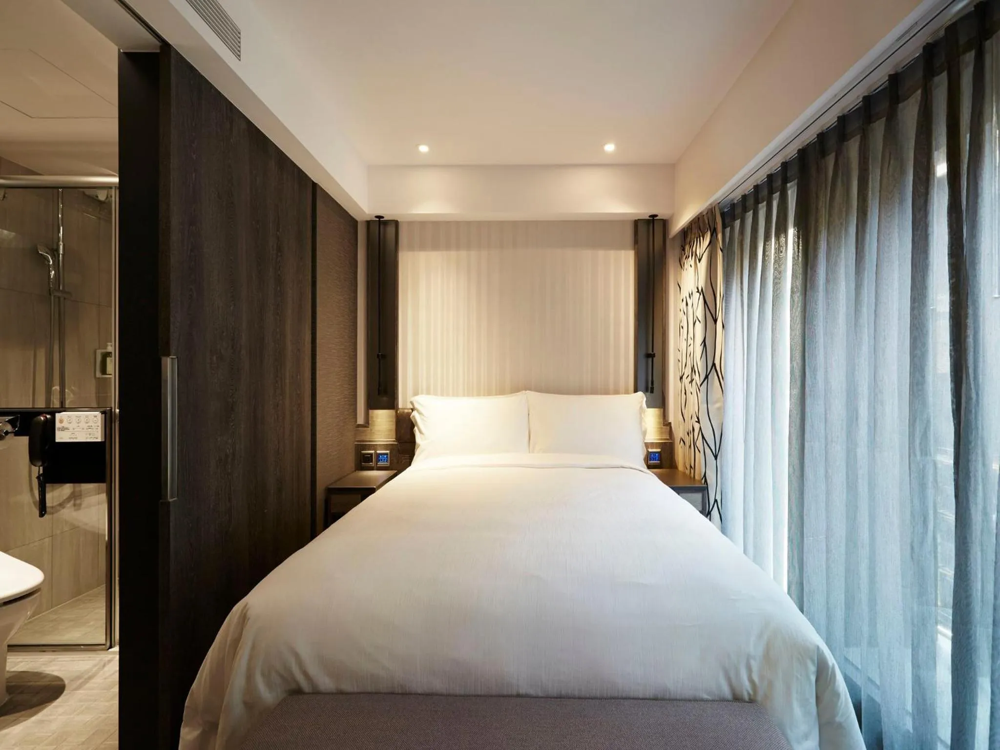 Bed in At Home Hotel Ximen