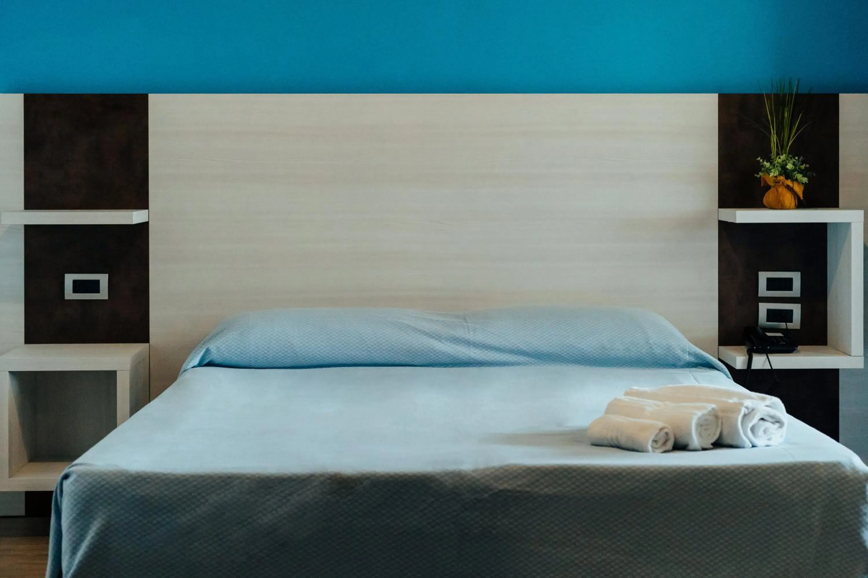 Bed in I Ginepri Hotel