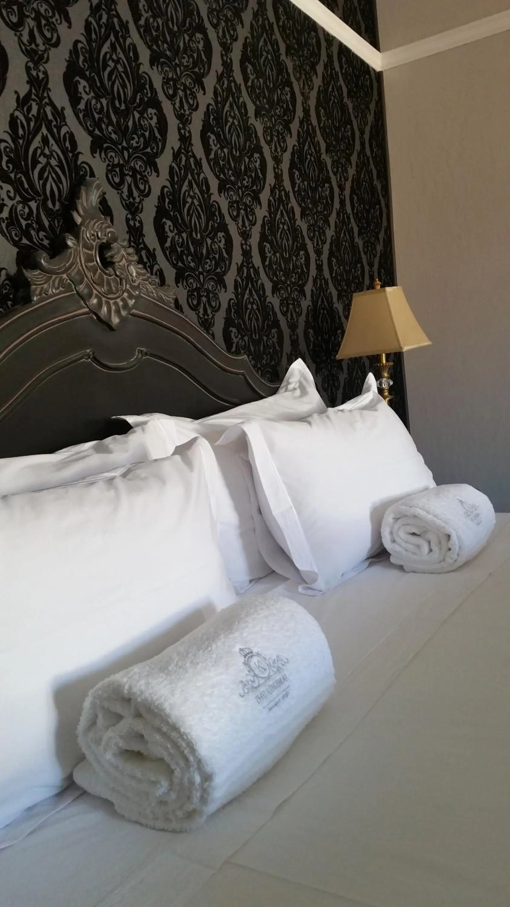 Bed in The Kingsman boutique Hotel