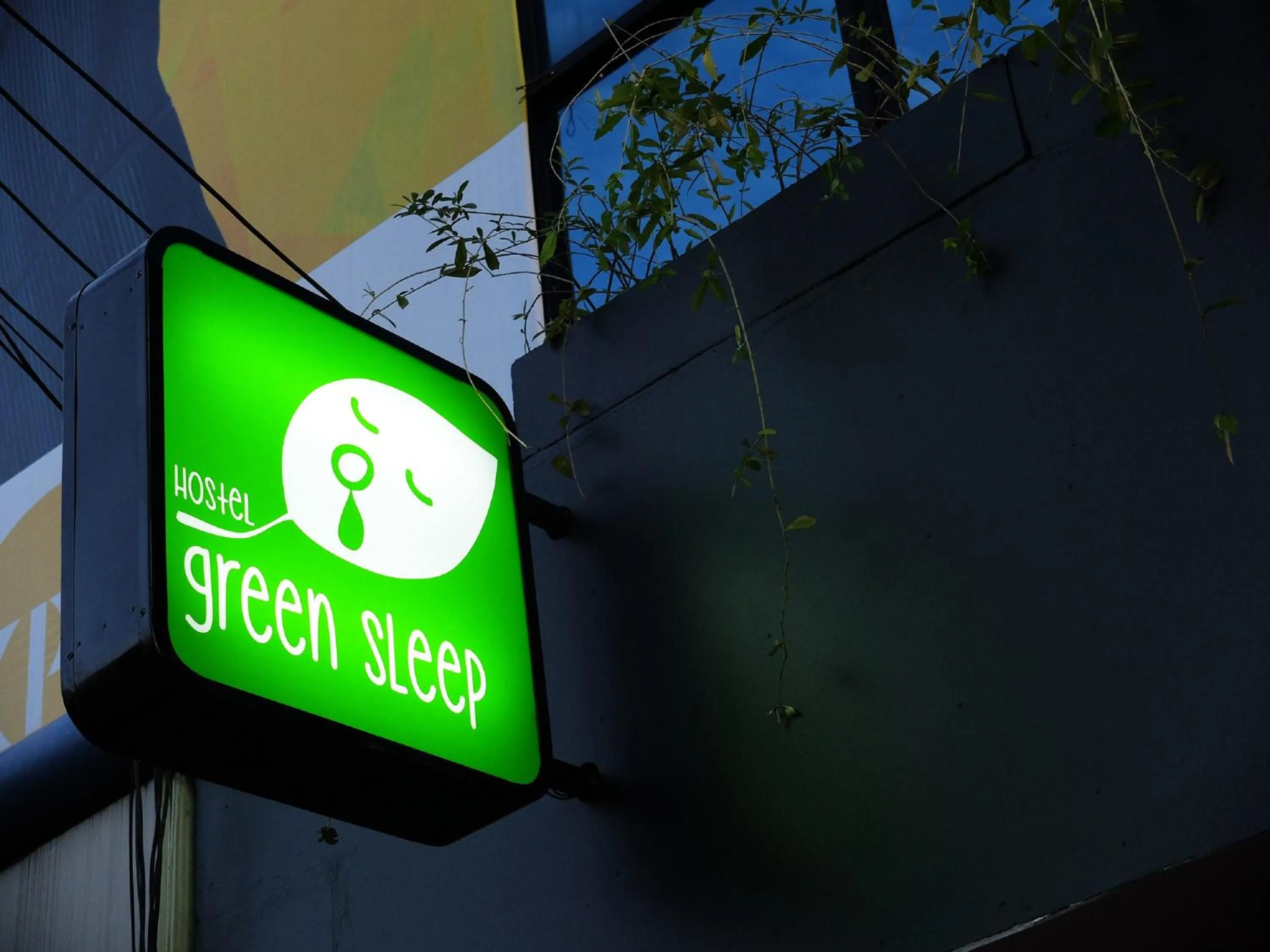 Property logo or sign in Green Sleep Hostel