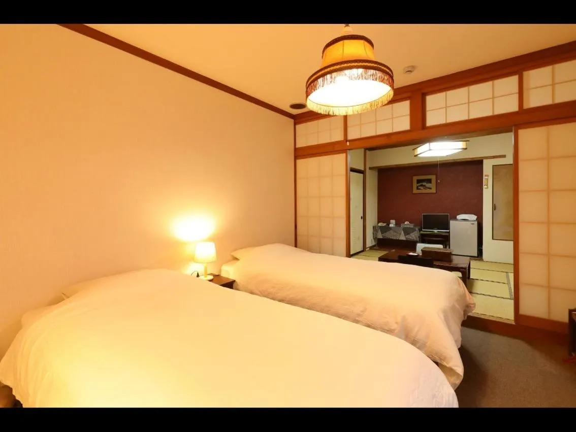 Photo of the whole room, Bed in Dai Onsen Matsudaya Ryokan