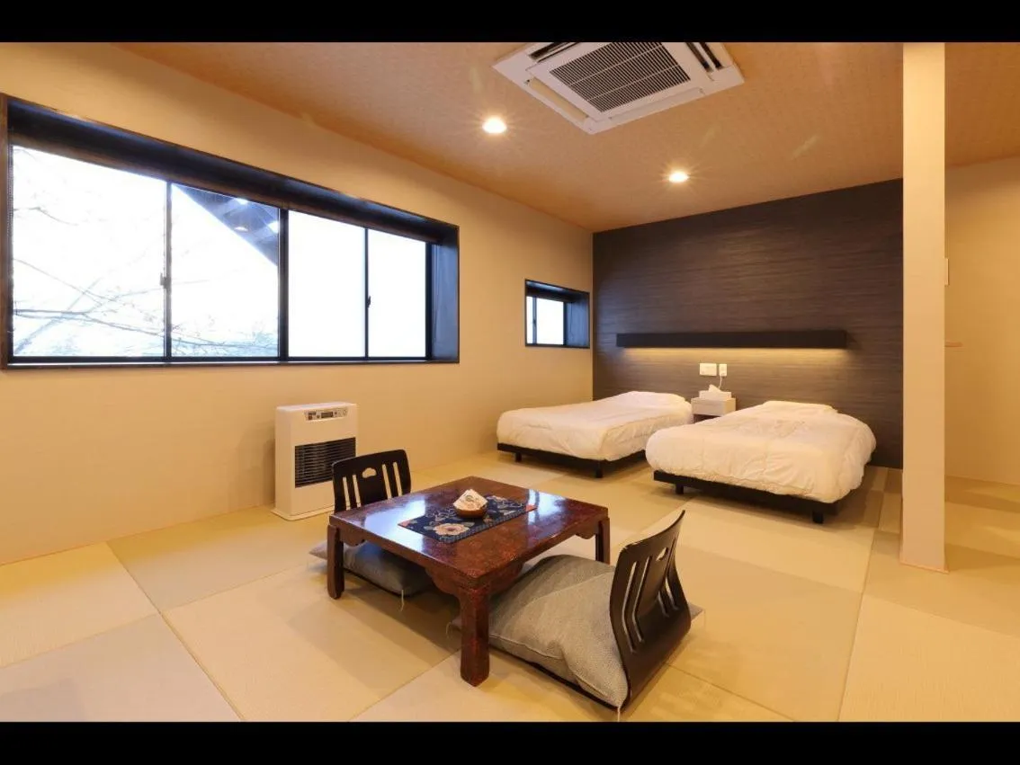 Photo of the whole room, Bed in Dai Onsen Matsudaya Ryokan