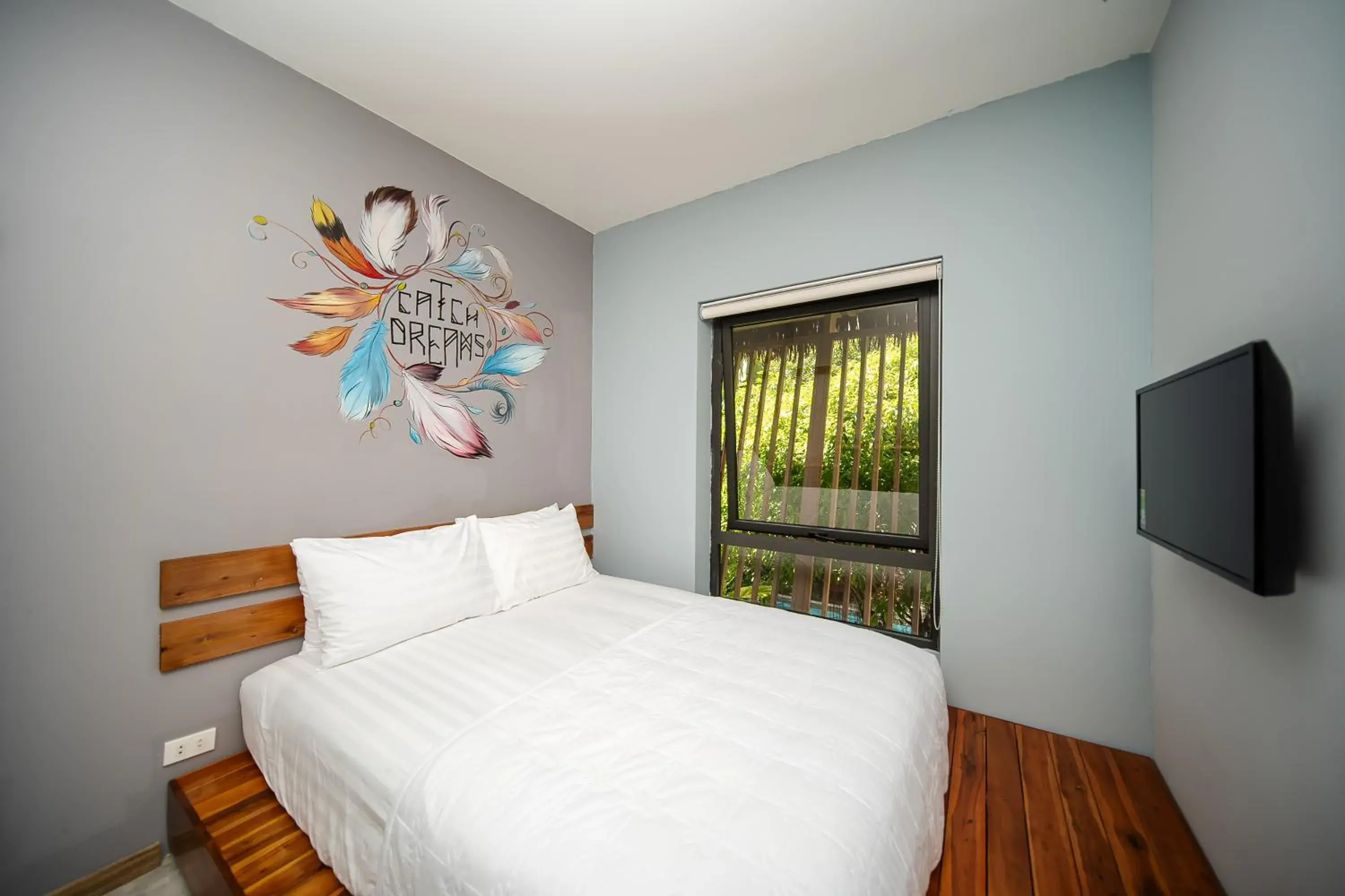 Deluxe Double Room with Window - single occupancy in 9Station Hostel & Bar Phu Quoc Deluxe Double Room with Window - single occupancy in 9Station Hostel & Bar Phu Quoc