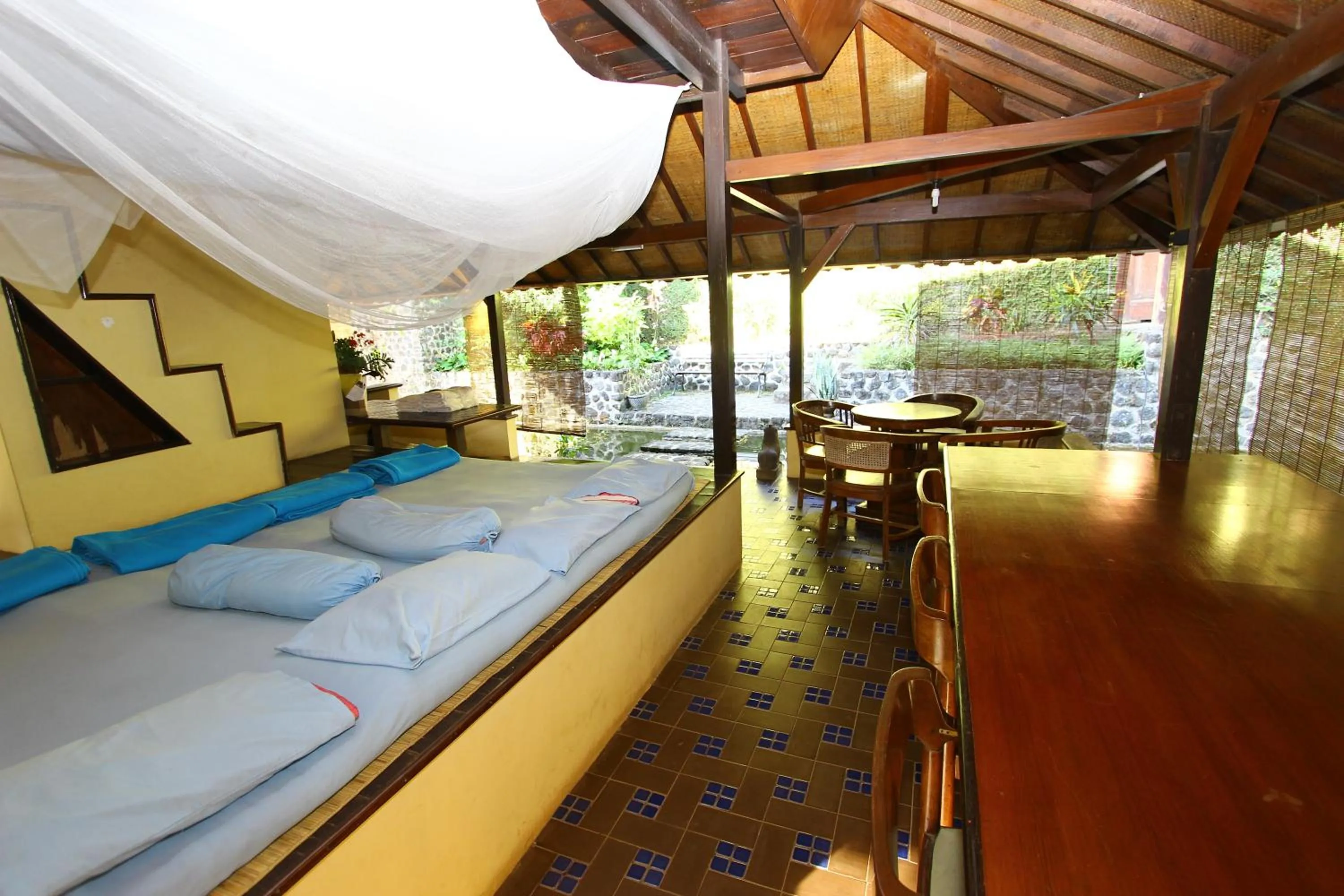 Communal lounge/ TV room, Bed in Ecolodge Seloliman