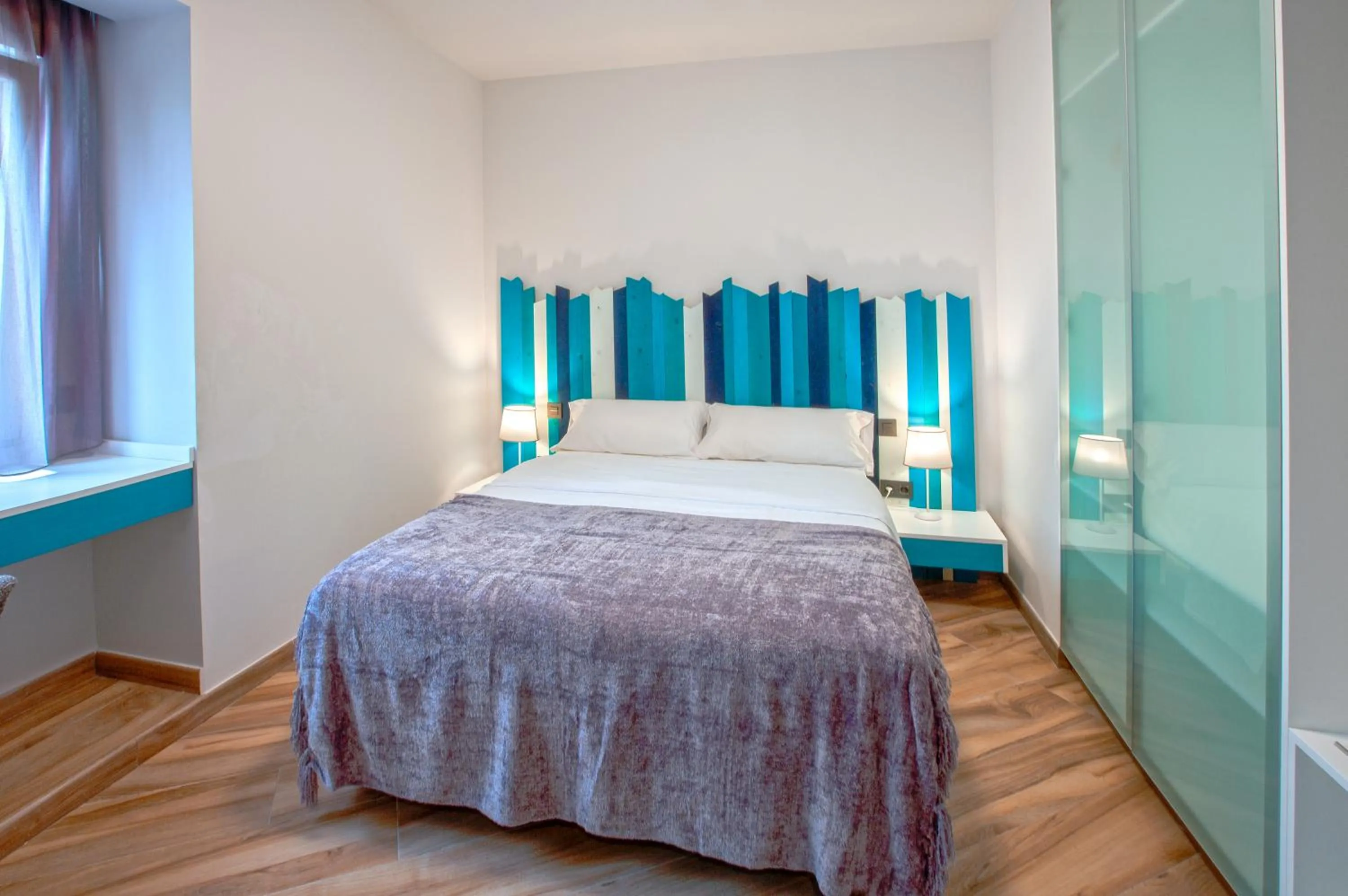 Bed in Gran Marina Suites