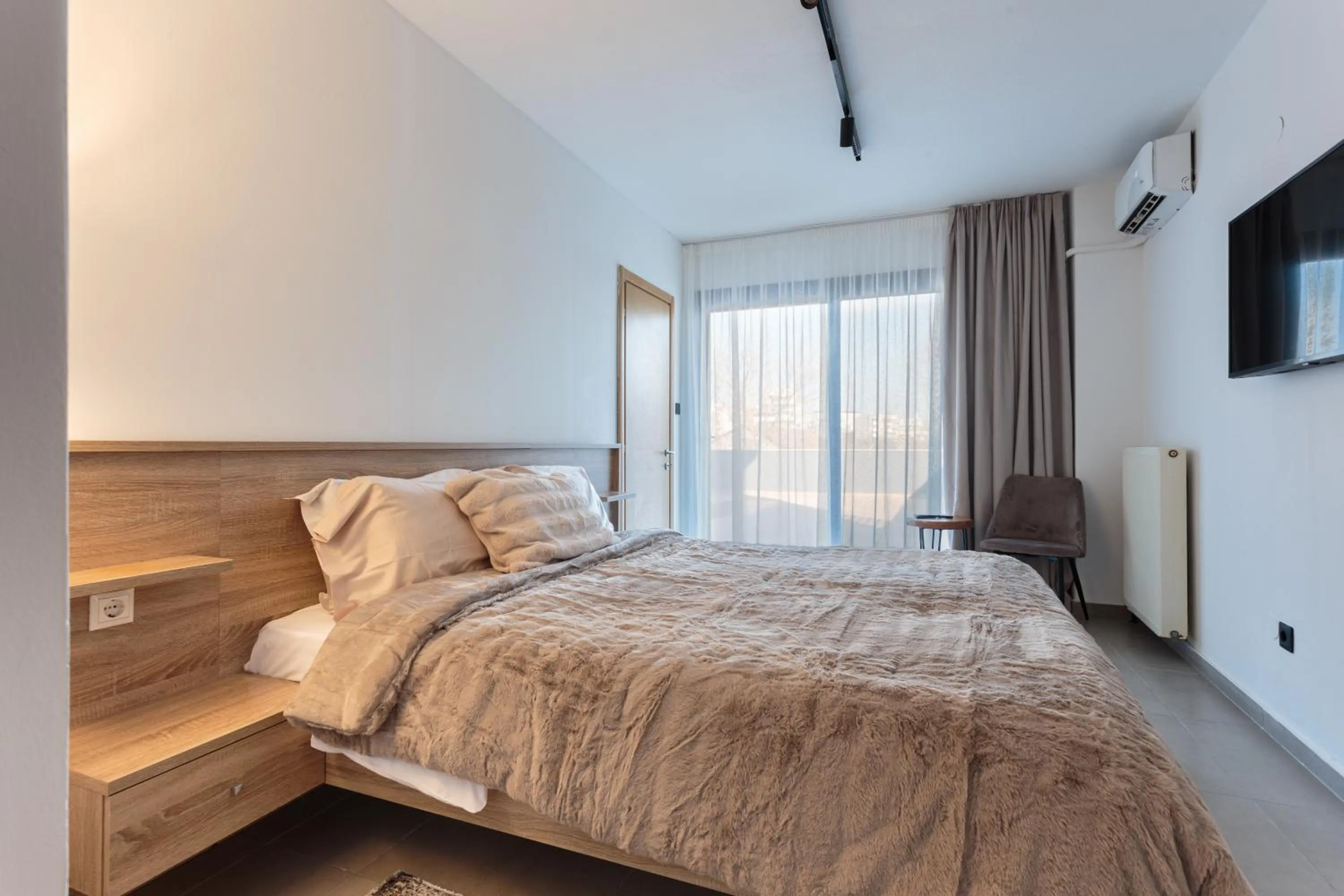 Bed in Limani Comfort Rooms