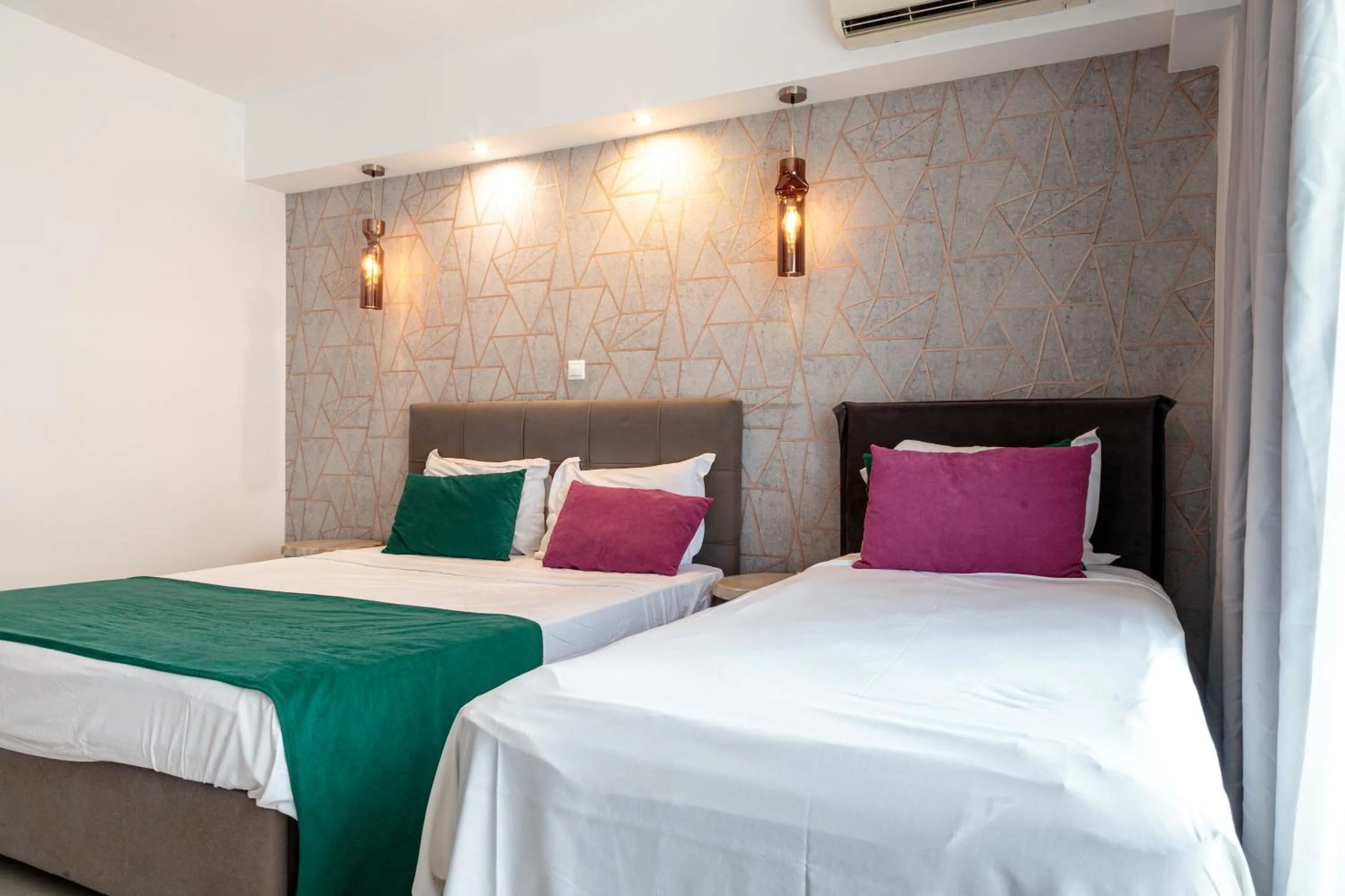 Bed in Limani Comfort Rooms