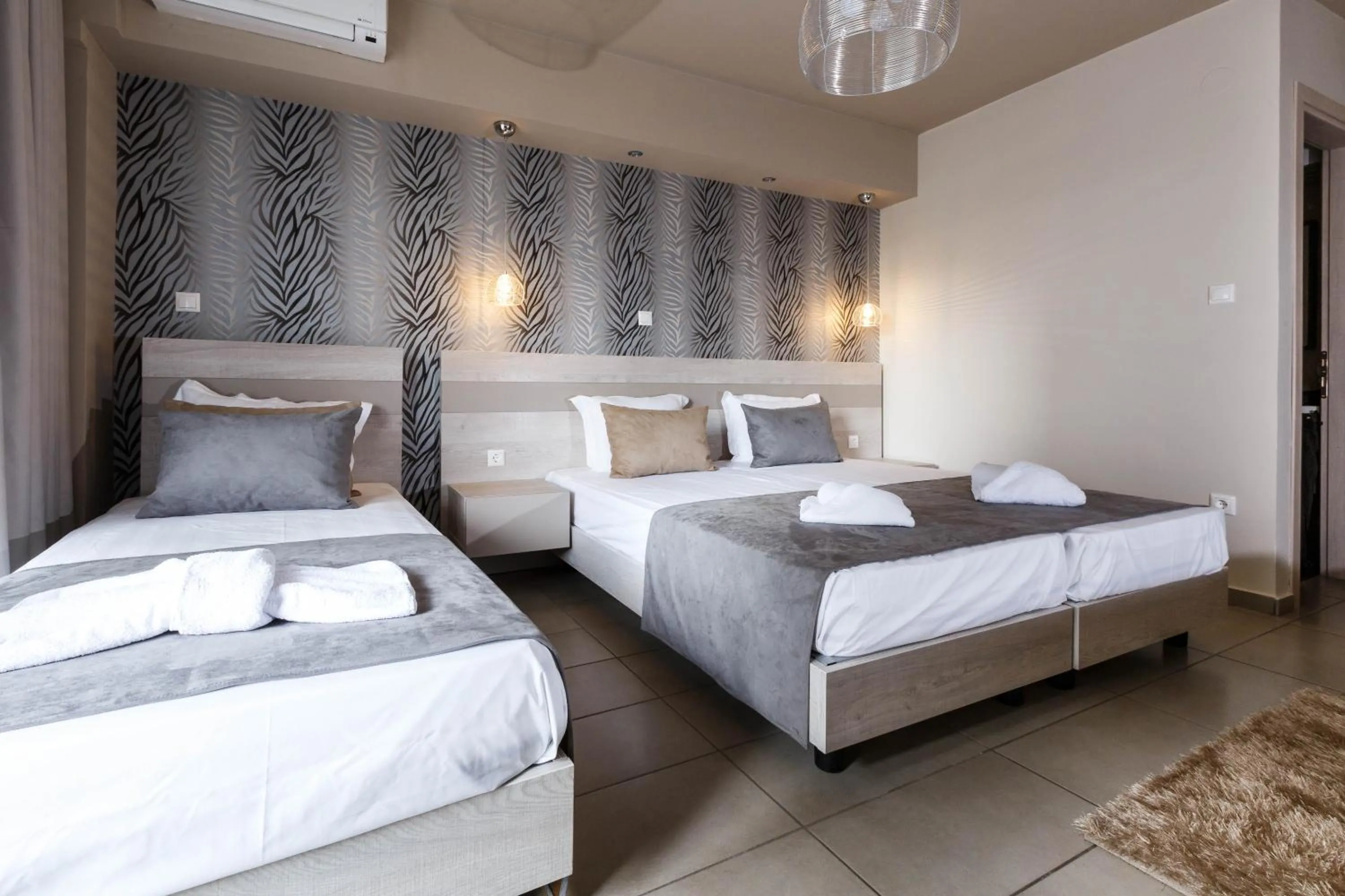 Bed in Limani Comfort Rooms