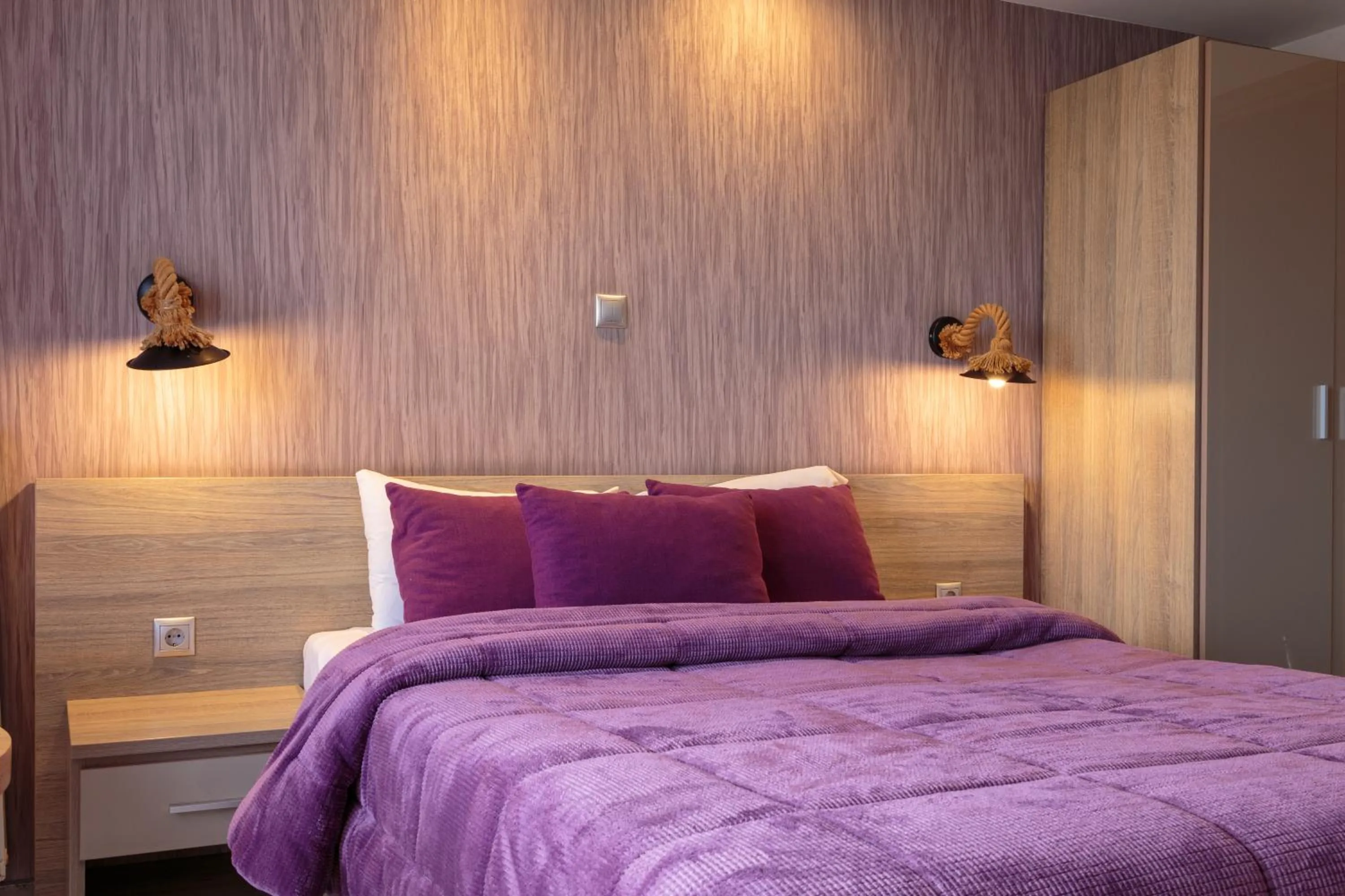 Bed in Limani Comfort Rooms