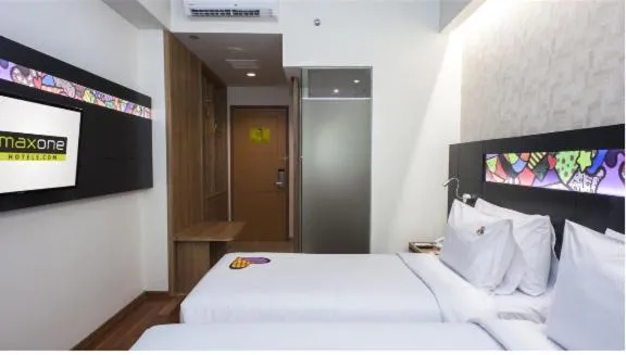 Bed in MaxOneHotels at Dharmahusada Surabaya
